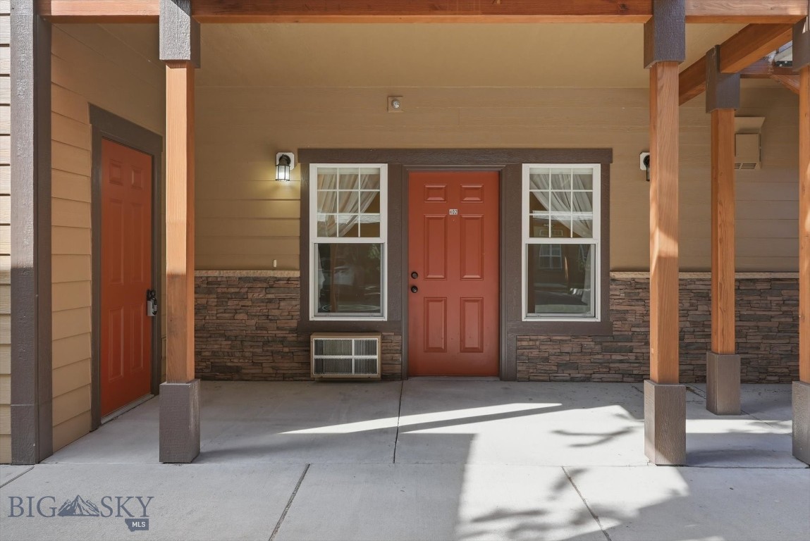 Welcome to this beautifully updated ground level 2 bed, 2 bath condo offering comfortable, move-in ready living at its finest! Soaring 9-foot ceilings and a cozy gas fireplace set the tone in the open living space, while the kitchen impresses with brand-new stainless steel appliances, room for a kitchen table, a peninsula for casual dining, and laundry area. Fresh interior paint, new window coverings, 30-year laminate flooring, and A/C wall unit round out the updates, making this unit truly turnkey. The spacious primary ensuite offers a walk-in shower, while the second bedroom features a walk-in closet and direct access to a full bath. Enjoy the covered patio, designated covered parking space, and storage unit. All of this in a prime location with easy access to N Reserve Street, shopping, dining, and more. A solid investment opportunity or the perfect place to call home. Seller is a licensed Montana real estate agent.