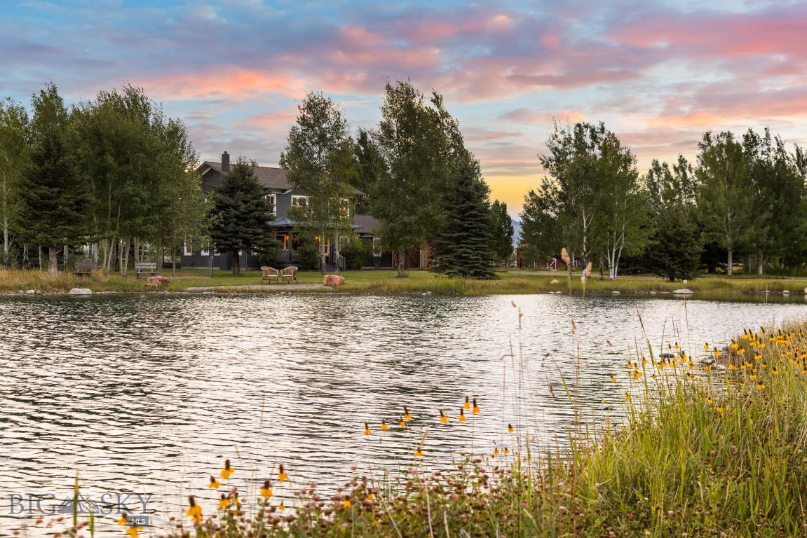 This postcard worthy residential farm retreat is located in the scenic Paradise Valley along a beautiful section of East River Road, near historic downtown Livingston Montana and Yellowstone National Park.  The  ± 28-acre property has many mature trees, striking views of the Absaroka-Beartooth and Gallatin mountains, a lovely pond, Elbow Creek frontage and ±15 acres of irrigated pasture.  The charming 1996 farmhouse has 3 bedrooms, 3 baths, front and back covered porches and attached garage.  The beautiful 2,200 sf shop/barn was built in 2010 with rough sawn fir, radiant heat, electrical, plumbing (3/4 shop bathroom) and beautiful windows, presenting an opportunity for a variety of uses.  For those who want to keep a couple of horses, there is an authentic 1,224-sf red horse barn built in 1996 with a tack room, 5 stalls with a turn out shed and corral adjacent.  This special farm retreat is extremely manageable due to its size leaving ample time for enjoying the multitude of recreational opportunities in the spectacular Yellowstone region.