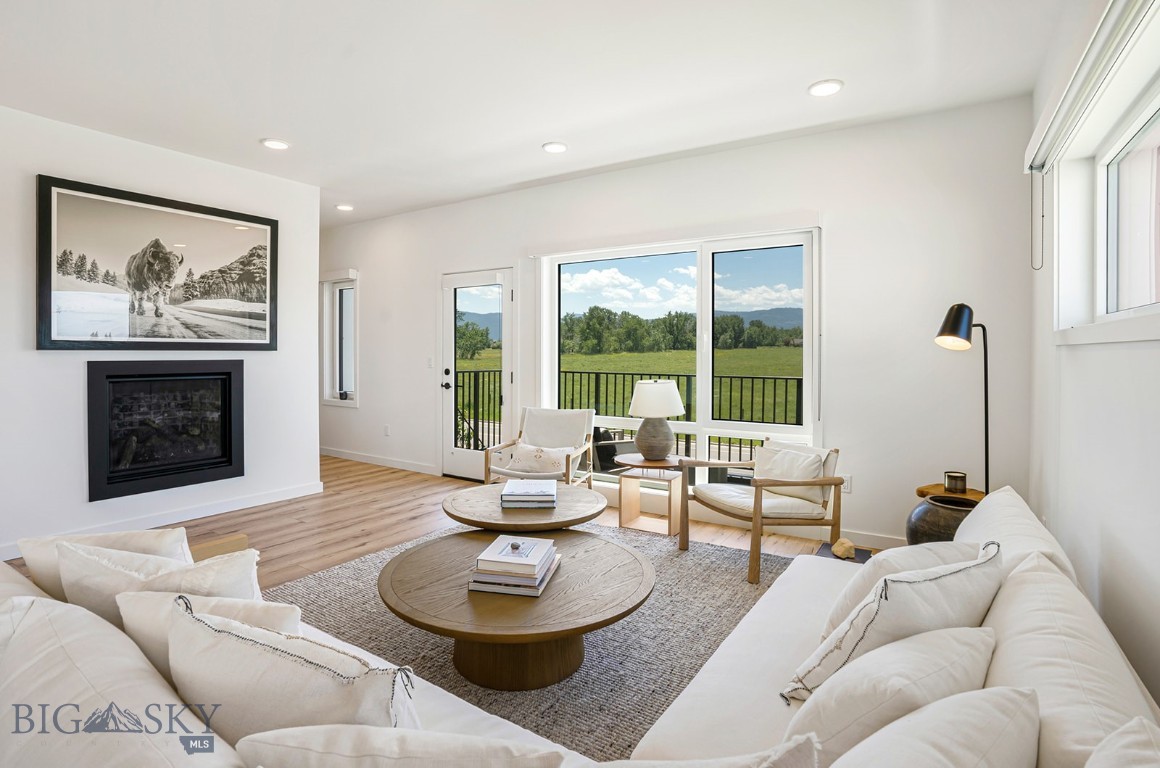 Lightly lived in and beautifully maintained, this end-unit condo showcases a clean, contemporary Zen-inspired design with a calm, inviting feel. Being sold furnished this turnkey home is ready for its new owner to move in and enjoy from day one. Tucked into a quiet corner of Gran Cielo, the property borders shared green space to the west and offers stunning views of lush open fields and the surrounding mountains from both the private balcony and the primary suite.

The first level features an oversized heated garage, a full guest bedroom, and a full bathroom, creating the perfect space for visitors.

The main living level is designed for both everyday living and entertaining, offering a bright, open-concept kitchen and living area, a convenient powder room, a laundry closet, and a private balcony overlooking open fields to the southwest.

On the third floor, you'll find the spacious primary suite complete with a walk-in closet and a private en-suite bathroom. This level also includes a versatile flex space, an additional bedroom, and a full bathroom, providing plenty of room for family, guests, or a dedicated home office. Contact your agent and schedule a showing it won't last long