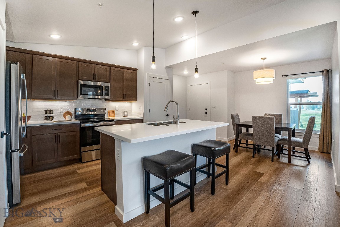 Welcome to 2440 Tschache Lane, Unit 302—an inviting condo offering comfort, convenience, and low-maintenance living in Bozeman. This well-maintained unit features an open and functional floor plan with abundant natural light, creating a warm and welcoming atmosphere. The kitchen flows seamlessly into the dining and living areas, making it ideal for both everyday living and entertaining. Enjoy easy access to Bozeman’s amenities, including shopping, dining, parks, and trail systems, while also being conveniently located near MSU and downtown.