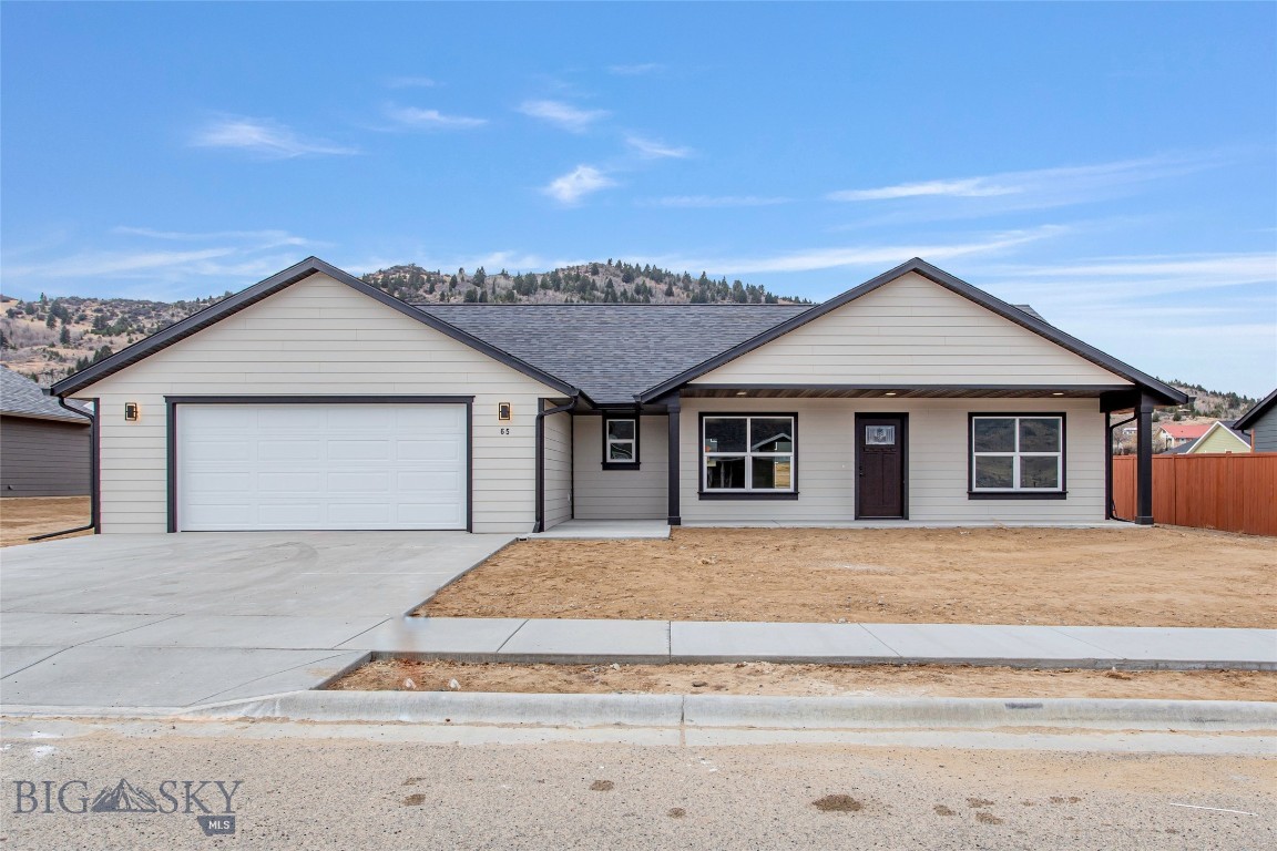 Enjoy easy one-level living in Copper Fox Estates! This soon-to-be-built home in one of Butte’s newest neighborhoods offers a thoughtfully designed floor plan with a spacious great room featuring stylish hardwood laminate flooring throughout the main living areas. Two bedrooms and a full bath are located just off the main living space, ideal for guests, family, or a home office
The primary suite offers a relaxing retreat with a soaking tub, dual vanities, generous storage, a walk-in closet, and convenient access to the laundry area. The attached double garage includes an oversized storage room, providing excellent additional space for organization or hobbies.
Step outside through the sliding glass doors from the dining area to enjoy the patio—perfect for summer evenings and outdoor entertaining. This home is currently under construction and combines functional design with beautiful finishes throughout. 
NOTE:PICTURES ARE OF SIMILAR HOME