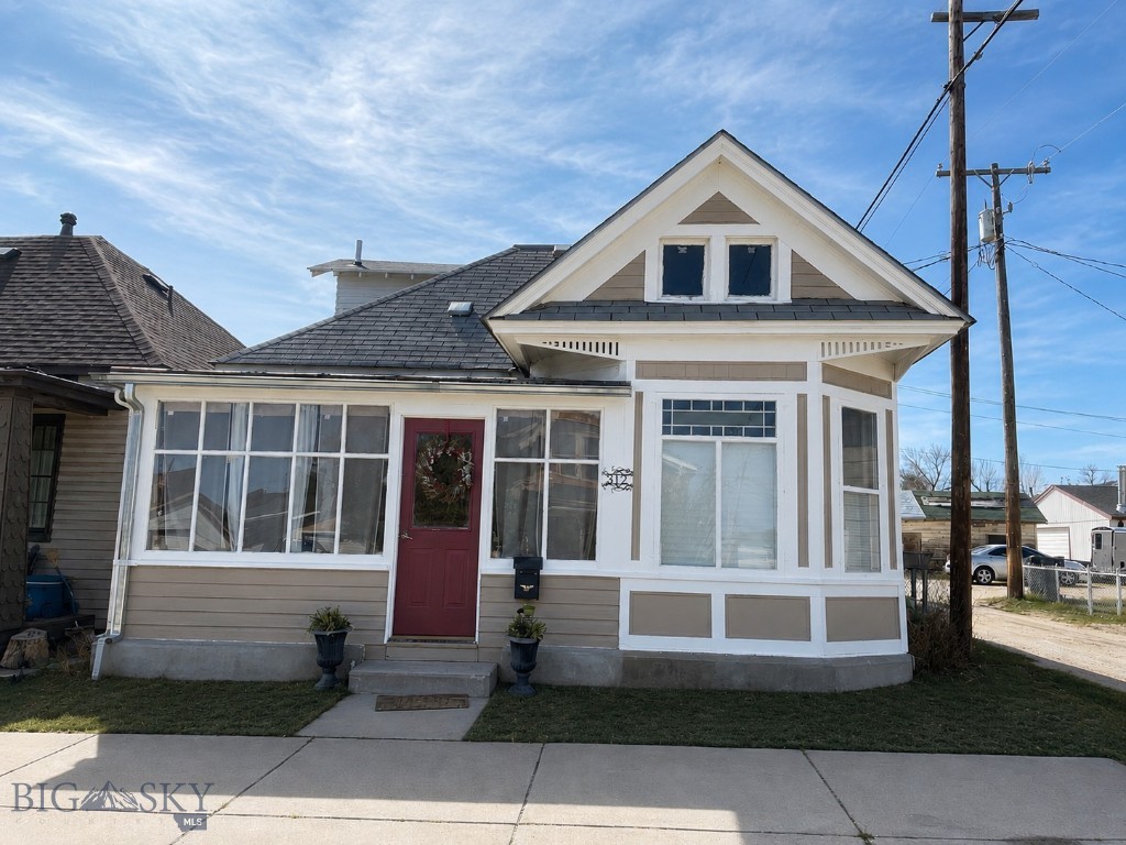 Charming West Side Bungalow in Anaconda
Welcome to this cozy and inviting 2-bedroom, 1½-bath bungalow built in 1915, full of character and thoughtful updates. Located in a great neighborhood on the west side of Anaconda, this home offers comfortable living with a warm, welcoming feel.
The enclosed front porch provides the perfect spot to relax and enjoy your morning coffee year-round. Inside, you’ll find an open-concept living room, dining area, and kitchen that creates a bright and functional living space. Hardwood floors add timeless charm throughout the home. The spacious main-floor full bathroom includes a convenient washer and dryer area, while the upstairs bedroom features its own attached half bath for added privacy and comfort.

Step outside to enjoy the backyard patio area, perfect for summer gatherings or quiet evenings outdoors. The small carport has been converted into a versatile 3-season room, offering additional space for relaxing, hobbies, or entertaining guests.

This well-maintained home combines historic character with practical living in one of Anaconda’s most desirable neighborhoods.