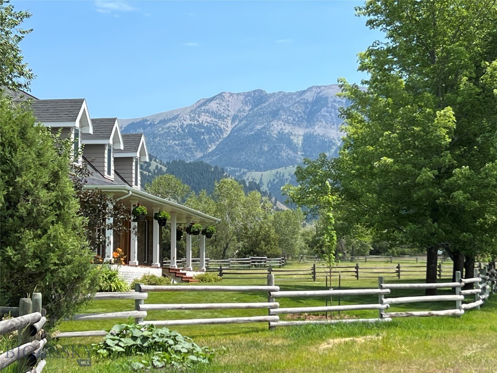 Tucked into Montana's coveted Middle Cottonwood area, Middle Cottonwood Homestead is a rare 20-acre offering with wide-open pastures, mature woodland, and a seasonal creek, ideal for livestock, horses, or simply enjoying unobstructed mountain views. The property boasts a 3,765-square-foot home with four bedrooms, three and a half bathrooms, vaulted ceilings, a wood-burning fireplace, and a covered porch perfect for unwinding after a day of hiking, fishing, or skiing, complemented by a large pole barn, tack shed, and firewood storage for equestrian or hobby farm use. What sets the property apart is its location, just up the road from National Forest land along the Bridger Range, yet only minutes from Bozeman's high-end amenities, roughly 15± minutes to Bozeman Yellowstone International Airport, 30± minutes to Bridger Bowl Ski Area, and about an hour and 15± minutes to Big Sky Resort, offering a rare blend of rural privacy, recreational access, and city convenience. The property's mix of open acreage and wooded terrain gives it a natural versatility, whether for grazing animals, growing hay, or simply enjoying the privacy of your own land. Wildlife is a frequent visitor here, with deer, elk, and other native species often seen moving through the property's fields and tree lines. For those who love four-season recreation, Middle Cottonwood Homestead offers direct access to hunting, fishing, hiking, and skiing all within a short drive, making it a true basecamp for the Montana lifestyle.