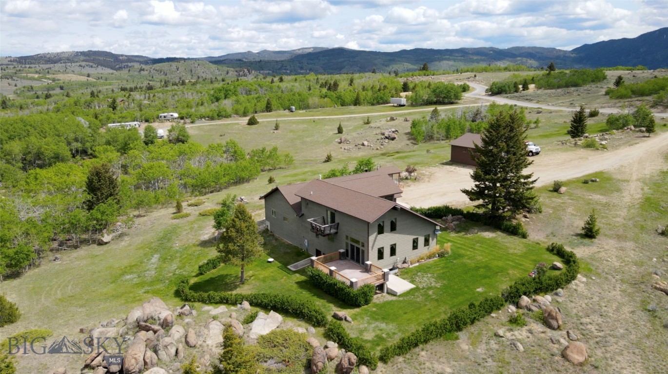 MOTIVATED SELLER!  WILL LOOK AT ALL OFFERS!!!
**Charming 5-bedroom Home on 6.98 acres with stunning mountain views! **
This beautifully maintained property boasts 5 spacious bedrooms and 3 full baths all situated on 6.98 acres of picturesque land. Owned by the original owners, this home has been meticulously cared for and is ready for its next chapter.
**KEY FEATURES**
** Spacious Living** Enjoy ample space perfect for families or guests.
**Attached 6 Car heated garage** Perfect for car enthusiasts or those needed extra storage, or workspace.
**Pole Barn** Additional outdoor space used for storage or a workshop providing versatility for hobbies or projects.
This property offers both comfort and functionality in a serene setting.  Don't miss the chance to own this remarkable home!