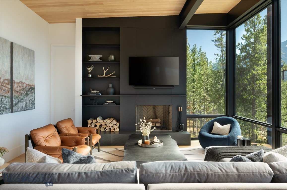 Tucked into the pristine alpine wilderness of Montana, this One&Only Moonlight Basin Private Home offers a rare fusion of striking contemporary architecture and the serene beauty of its natural surroundings. Framed by towering pines and majestic mountain vistas, the residence is intentionally designed to complement its setting—offering a lifestyle that is both immersive and effortlessly luxurious.

This six-bedroom retreat provides expansive indoor and outdoor living, where floor-to-ceiling windows capture uninterrupted views and an abundance of natural light. Roaring fireplaces, refined finishes, and thoughtfully curated details create an atmosphere of warmth, sophistication, and understated elegance.

The open-concept design encourages effortless flow between the interior living spaces and generous terraces, ideal for hosting family and friends or simply relaxing beneath Montana’s vast skies. Whether watching alpenglow settle over the peaks or unwinding after a day of skiing, hiking, or fly fishing, this residence serves as a refined mountain escape in every season.

Positioned within the exclusive One&Only Moonlight Basin resort, owners enjoy access to a premier suite of amenities—from world-class dining and wellness offerings to curated outdoor experiences—all delivered with the globally renowned service that defines the One&Only brand.

This is more than a home—it’s a private sanctuary in one of the American West’s most captivating landscapes.
