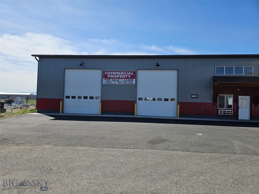 THIS COMMERCIAL CONDO IS APPROXIMMATELY 3855 SF WITH 288SF MEZZANINE OR TOTAL 4143 SF. CONCRETE FLOORS ARE 5 IN THICK WITH REINFORCED REBAR FOR HEAVY TRUCKS. CONCRETE FLOORS ARE SLOPED INTO DRAIN BOXES. THE WALLS ARE SIPS PANELS AND ARE 6 INCH. FLOOR TO CEILING IS 17 FEET HIGH SO MEZZANINE IS APPROX 8 FEET HIGH. THE OFFICE IS APPROX 12 X 12 WITH A MINI SPLIT FOR HEAT AND COOLING. THERE IS A 12 X 12 MECHANICAL ROOM WITH TOILET, SINK AND SHOWER STALL. MECHANICAL ROOM HAS ELECTRIC BASEBOARD HEAT. THERE IS HOT AND COLD WATER TO THE SHOP AND WASHER AND DRYER HOOK UP. SHOP IS HEATED WITH 300,000 BTU MODINE NATURAL GAS UNIT. INTERIOR OF SHOP IS PAINTED WHITE WITH WHITE METAL CEILING. THERE IS A 200 AMP ELECTRICAL PANEL AND HIGH BAY LED LIGHTS. THESE UNITS ARE VERY ECONOMICAL TO HEAT. THREE PHASE POWER IS AVAILABLE. BUYER TO VERIFY SF. SELLER IS A LICENSED REAL ESTATE BROKER IN THE STATE OF MONTANA ! THE LOT ALLOWS BIG TRUCKS TO LOOP AROUND BUILDING AND THERE IS GREAT ACCESS FOR BACKING LARGE TRAILERS TO FRONT 12 X 14 OVERHEAD DOORS. SOME PICS ARE OF A SIMULAR UNIT !!