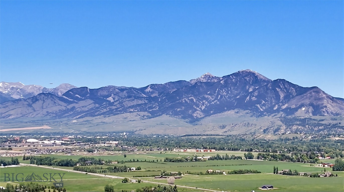 Discover the perfect intersection of expansive mountain living and elite modern convenience at Owl Creek. This exclusive community comprises 35 luxury parcels, ranging from 1 to 2.2 acres, providing the ultimate canvas for you to design and build your bespoke custom home. Every lot is thoughtfully positioned to capture stunning views of both the Bridger Mountains and the Gallatin Mountain Range, ensuring a serene and picturesque backdrop for your daily life. While the setting feels like a private escape, you remain remarkably connected, located just ten minutes from the vibrant energy of Main Street Bozeman, Montana State University, and the comprehensive services of Bozeman Health. Life at Owl Creek extends far beyond your property line, centered around a sophisticated private clubhouse designed to rival the finest resorts. Residents enjoy exclusive access to a professional 25-yard lap pool, a high-tech golf simulator, and a fully equipped private gym. After a day of Montana adventure, you can retreat to the dedicated men’s and women’s saunas. For those who balance work and play, the onsite conference room provides a professional space for meetings just steps from your front door. The neighborhood's natural charm is further enhanced by its commitment to tranquility and outdoor leisure. Owl Creek features three pristine ponds—in addition to the signature community pond at The Summits—inviting residents to enjoy peaceful strolls or quiet moments by the water at their leisure. Whether you are drawn by the expansive acreage, the world-class amenities, or the dual-range mountain views, Owl Creek offers a rare opportunity to secure a lifestyle of luxury and mountain elegance.