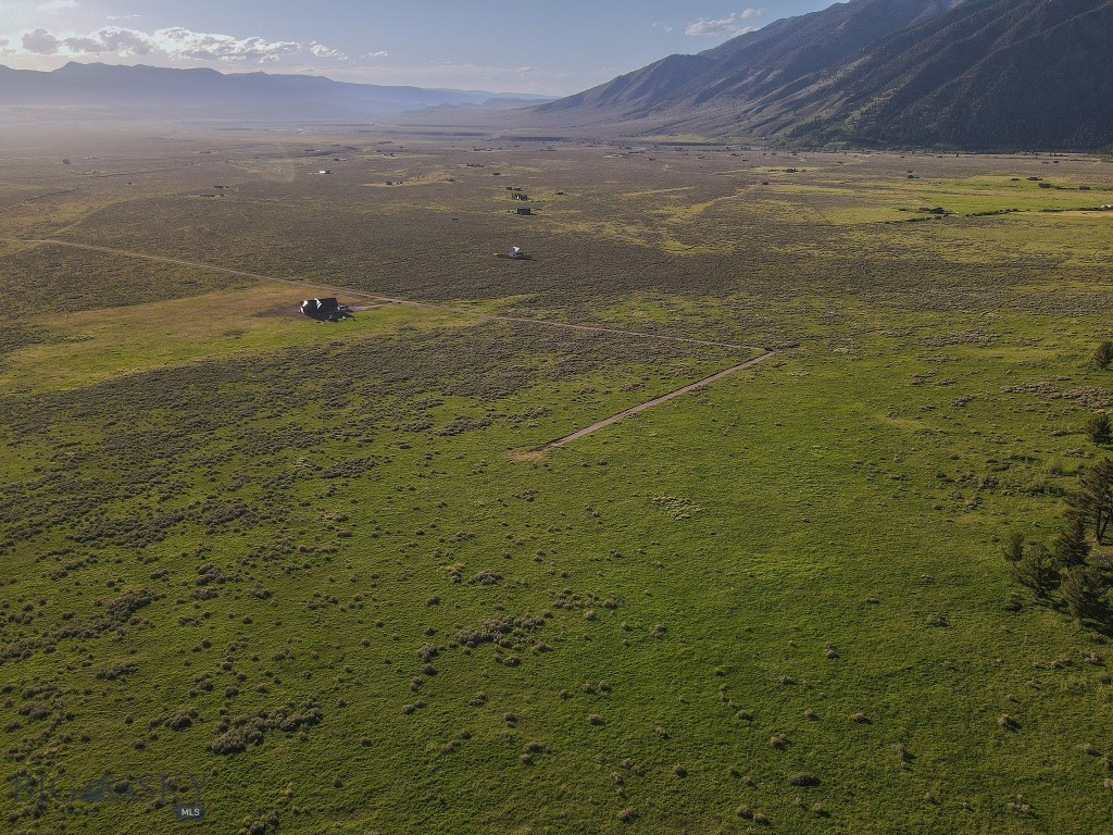 Experience the privacy, views, and endless recreation opportunities of this exceptional 19.88-acre parcel bordering Gallatin National Forest—public land literally right out your back door. Tucked away at the end of the road and accessed via recently improved Continental Divide Ranch Road and Paintbrush Trail, this property offers remarkable seclusion while showcasing sweeping views across the Madison Valley and the mountains east of Highway 87.
Wildlife is abundant, with elk, deer, pronghorn, and moose frequently seen throughout the area. World-class fly fishing on the Madison River is just minutes away, along with easy access to Hebgen, Quake, Wade, Cliff, and Henry’s Lakes for boating, fishing, and year-round recreation.
Many of the preliminary steps toward building have already been completed. Madison County Pre-Construction Safety Review approval has been obtained, a permanent address has been assigned (3 S. Paintbrush Trail, Cameron, MT 59720), and an electrical permit has already been issued through December 2, 2026. 3 Rivers fiber optic service is available at the lot, and Northwestern Energy power is located approximately 1000 feet away at Lot 13 along Continental Divide Ranch Road. The seller has also recently invested $7,000 to complete road improvements. Road maintenance and snow removal is the responsibility of the individual owners.
Continental Divide Ranch HOA membership is optional and there are no HOA dues; however, all property owners are subject to the recorded covenants and architectural review requirements whether or not owners elect to join the HOA.
Whether you're envisioning a mountain retreat, full-time residence, or legacy property, this rare offering combines end-of-the-road privacy, breathtaking scenery, and direct access to thousands of acres of National Forest land.