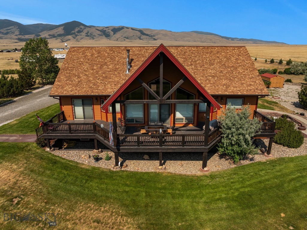 Welcome to your dream Montana retreat at 95 Cactus Lane, Townsend, MT! This captivating 5-bedroom, 3.5-bathroom home perfectly marries modern elegance with the rugged charm of Big Sky Country. Located conveniently close to Townsend, Helena, Belgrade, and Bozeman, this property offers breathtaking views of Elkhorn Mountain, and Big Belt Mountain that will leave you in awe every day. Step inside and be greeted by the warmth of hardwood floors in the dining and living areas, while the ceramic floors in three bathrooms and slate floors in the mudroom and kitchen add a touch of sophistication. The home offers two full kitchens, with one featuring stunning granite countertops, hickory cabinets, and custom shelving. Enjoy the convenience of two laundry areas and the comfort of a wood-burning stove in the basement and a propane stove on the main floor. The master bedroom is a true retreat with a walk-in closet and sliding doors. Plus, the total home generator ensures uninterrupted power, adding an extra layer of security and convenience. Outside, the fenced and gated property boasts mature landscaping, an underground sprinkler system, and two custom gates for added security and style. The 5-stall garage and detached storage shed offer ample space for all your needs. Relax on the two covered decks or entertain friends in the RV area. An entry ramp from the garage into the house ensures accessibility for all. For outdoor enthusiasts, this property is a paradise. With federal lands in front of the house and close proximity to Canyon Ferry Lake, you'll have endless opportunities for hunting, fishing, boating, and more. Imagine catching walleye, enjoying boating adventures, or simply soaking in the natural beauty around you. Beautifully maintained, the home features  a 1000-gallon propane tank owned, ensuring your comfort and peace of mind. Additionally, this property comes with no covenants, giving you the freedom to truly make it your own. Don’t miss the chance to own this exceptional property that offers the best of Montana living. Experience the unparalleled lifestyle that awaits you in this stunning home.