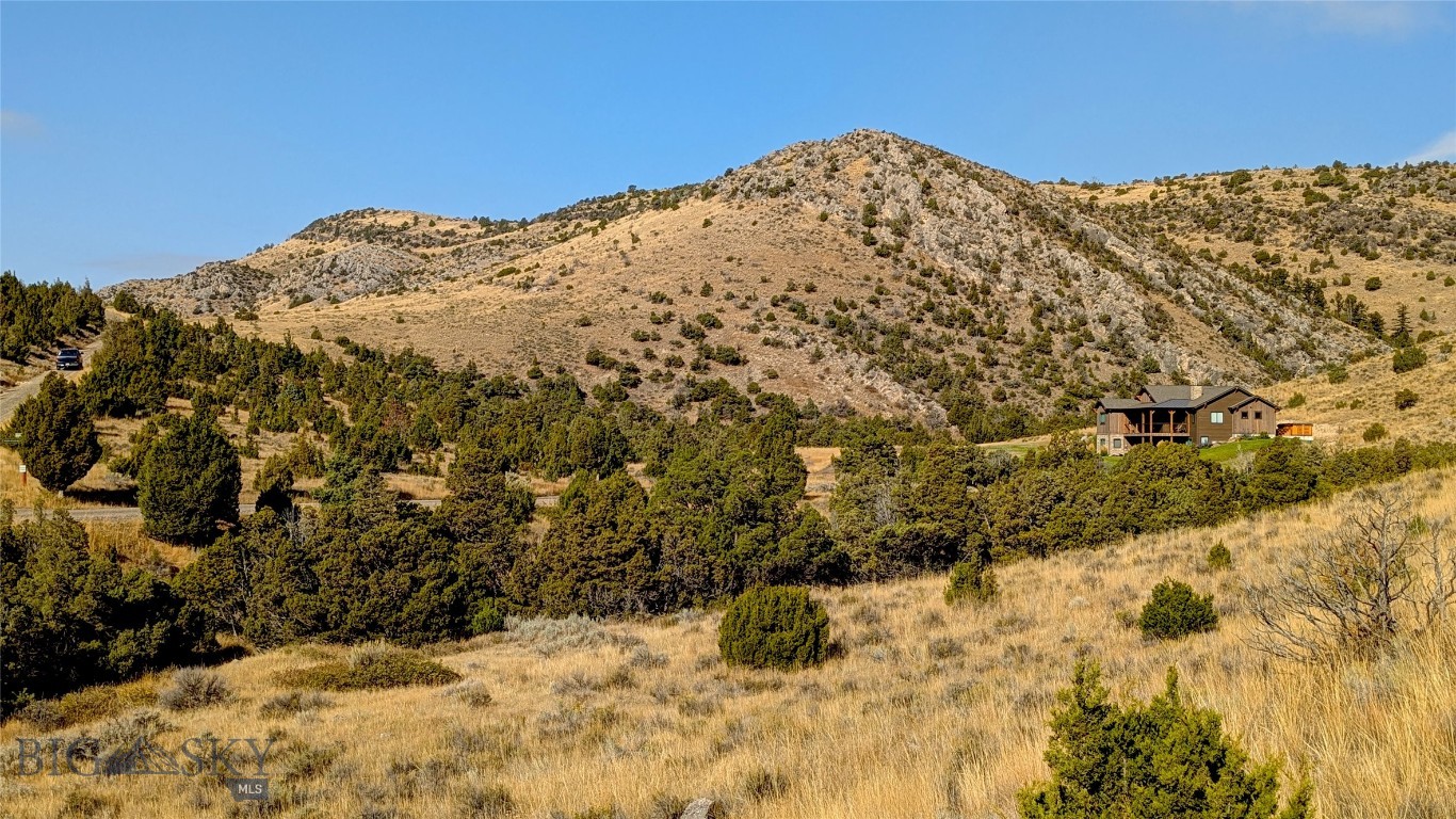 Here’s a rare opportunity to own pristine Montana land. Spanning approximately 19.5 acres, this property represents one of the most compelling values for acreage in all of Gallatin County.  Several attractive building sites offer easy, year-round access and a peaceful sense of seclusion. The land also supports thriving wildlife habitat, with frequent sightings of deer and elk, along wide variety of bird species.  Positioned on the desirable lower terraces of Gallatin River Ranch—closer to both the river and town—the property benefits from direct access via a well-maintained county road, making it as practical as it is scenic.

Gallatin River Ranch is a sought-after development encompassing over 6,000 acres, known for its private access to two renowned rivers, an impressive equestrian center, more than 20 miles of trails and private roads, and over 1,600 acres of shared open space. It also lies within the highly regarded Manhattan School District.  The property is conveniently located just 10 minutes from Manhattan, 20 minutes from Bozeman Yellowstone International Airport, and 30 minutes from Bozeman’s vibrant Main Street.

For buyers seeking space, privacy, and proximity in the greater Bozeman area, this property stands out. TBD Moccasin Trail is worthy of a closer look.
