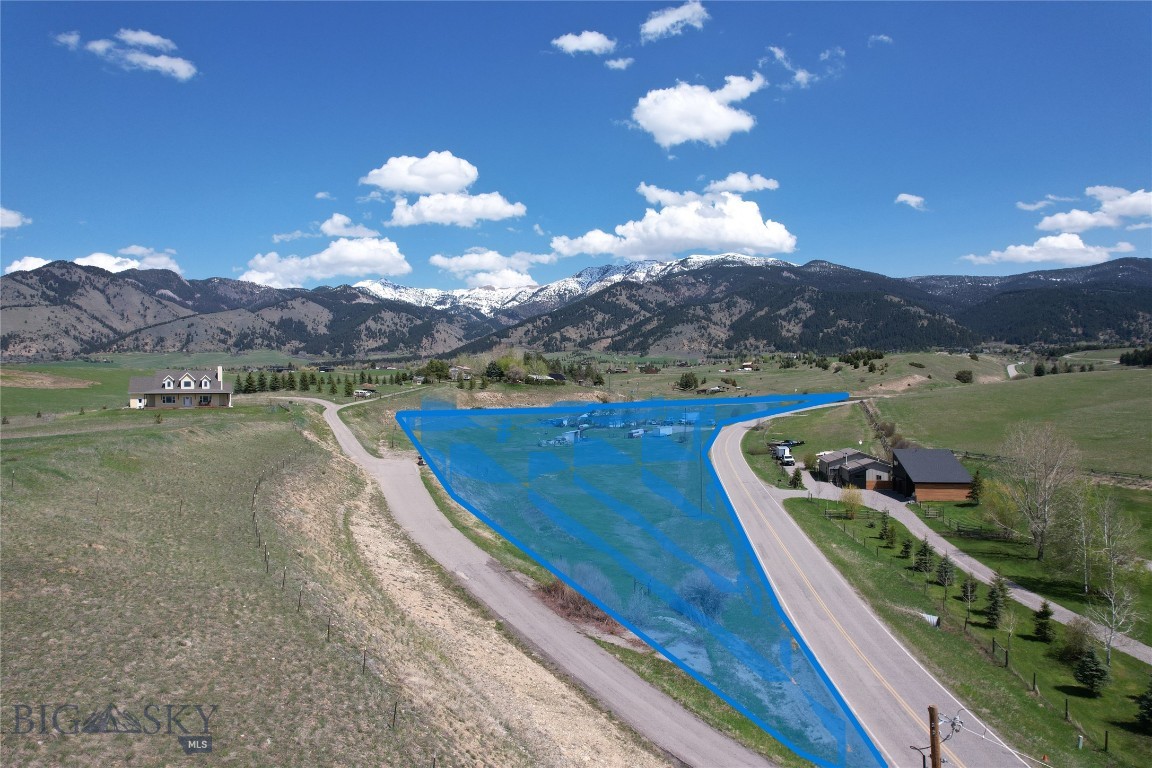 Beautiful 5.2 Acres nestled at the base of the Bridger Mountains in the desirable Springhill Community of Bozeman, MT. This acreage has well, power, septic. The mobile home is not on foundation and can easily be moved to make way for your DREAM home in this DREAM LOCATION! Has an adequate shop for toys and storage and the property is fenced for horses. Don't let this Sypes Canyon beauty pass you by! Minutes to recreation in the mountains and minutes to shopping and dining in Bozeman. This perfect location offers country living close to town and I-90.