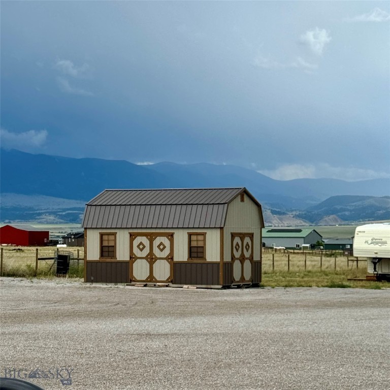 Bring the RV and start living the Montana dream — the hard part is already done.
This fully usable 1-acre parcel on Berry Lane just outside Townsend is that rare "ready to build" opportunity where the infrastructure is already in place. Power is connected, septic is installed, and a brand-new high-producing well is in the ground. Pull in, plug up, and settle.
The 2024 well is the standout: drilled to 501 feet with a strong 30 GPM air-test flow — an exceptional domestic water supply that leaves plenty of room for a home, a garden, and the full Montana lifestyle. Good water is everything out here, and this parcel has it in abundance.
A 12x20 framed shed (built 2021) already serves as the perfect camp headquarters — your dining hall, bunk shed, or gear storage while you plan the next chapter. The full acre is fenced, level, and open, framed by big Broadwater County sky and mountain views in every direction.
This is a true blank canvas with real infrastructure behind it. Park the camper and enjoy your weekends now. Build the lake getaway you've been dreaming of. Or put down roots and raise your forever home right here — the timeline is yours.
Set in the heart of the Townsend Valley, you're just minutes from Canyon Ferry Lake and its world-class boating, fishing, and paddling, with the Big Belt and Elkhorn Mountains at your back and Helena, Bozeman, and Butte all within easy reach.
Well in. Septic in. Power on. Fenced and waiting. All that's left is your Montana story.