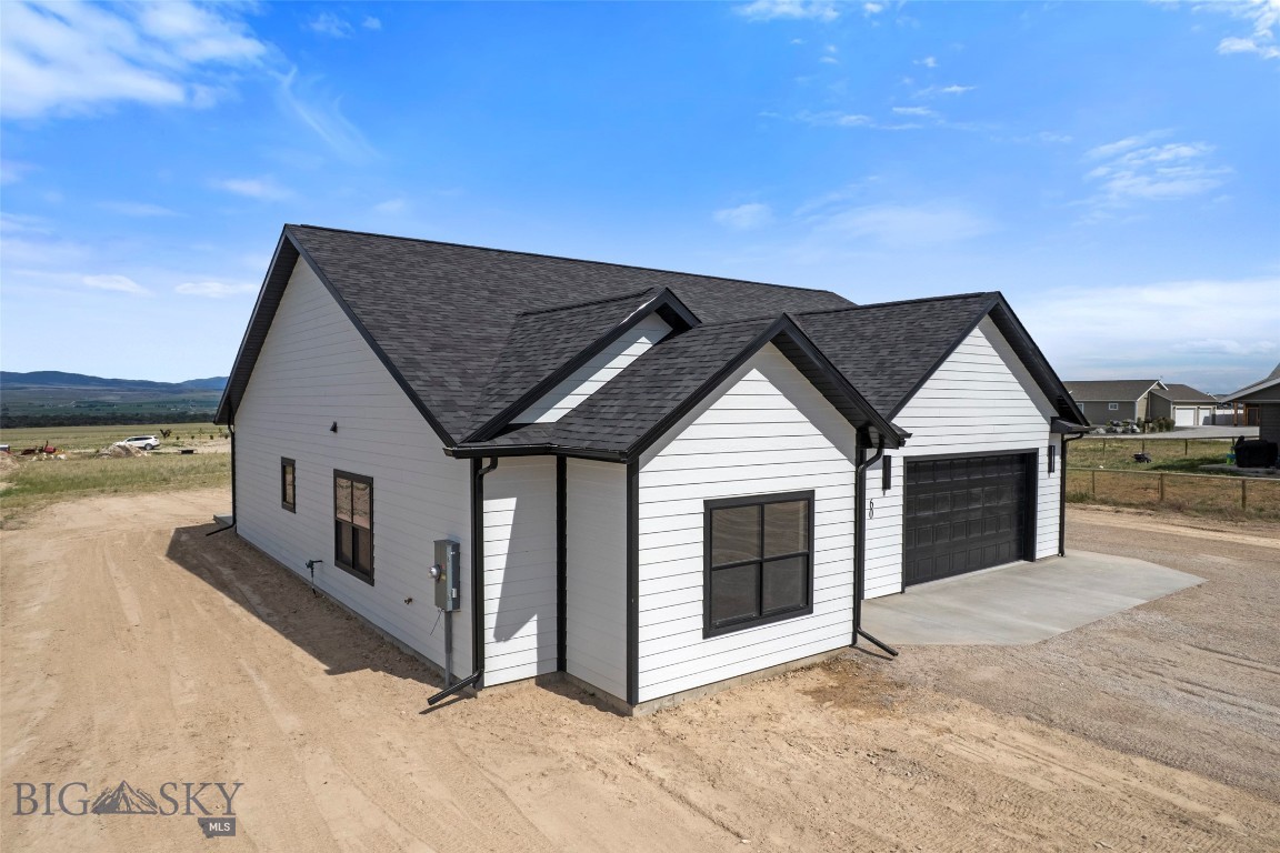 Brand-New Construction on a Full Acre in Townsend, Montana Welcome to 60 Nez Perce Trail — a 2025-built, 1,702 sq ft single-level ranch home set on a flat, usable 1.00-acre lot in Indian Creek Estates. This 3-bedroom, 2-bath home blends modern finishes with wide-open Montana views, framed by the Big Belt and Elkhorn Mountains in every direction. Step inside to soaring vaulted ceilings, plank flooring, and an open-concept great room flooded with natural light. The chef's kitchen is the showstopper: crisp solid surface countertops, rich espresso shaker cabinetry, stainless steel appliances, a gas range with center griddle, a center island, and designer pendant and recessed lighting. A sliding glass door off the dining area opens to sweeping valley and mountain vistas. The primary suite offers a private bath with a walk-in shower, vanity, and matte-black fixtures. Two additional bedrooms and a full second bath provide room for family or guests. Clean, contemporary black-and-white exterior with crisp masonite siding, asphalt shingle roofing, and an oversized attached 2-car garage with opener. Outside, the acre is a blank canvas — space for a shop, garden, animals, or RV parking — room to spread out. Forced-air gas heat keeps winters comfortable, and the crawl-space foundation keeps it low-maintenance. Located minutes from Townsend, Canyon Ferry Lake, and the Missouri River, this is turn-key Montana living: world-class fishing, boating, hunting, and recreation right at your doorstep, with Helena an easy commute away. New build. Big views. Real Montana space. Schedule your private showing today.
Supplemental Remarks