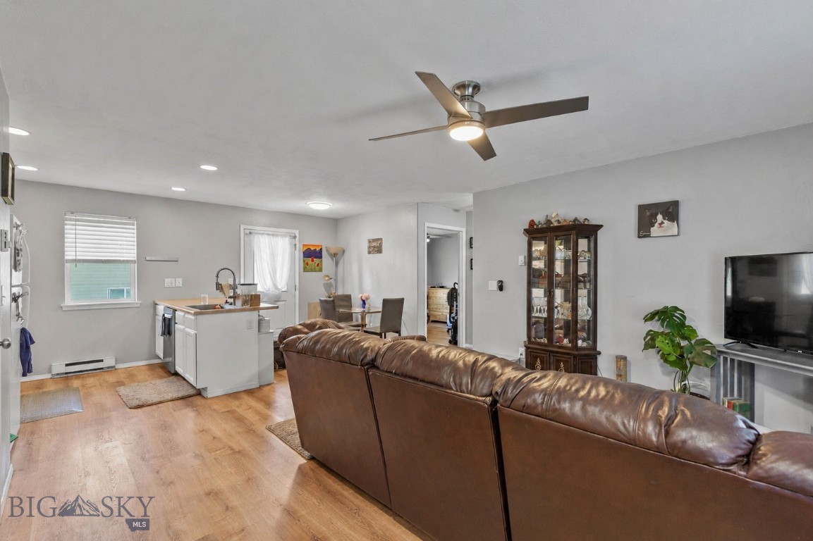 Welcome home to this inviting 2-bedroom, 1-bathroom condo offering comfortable, low-maintenance living in a peaceful setting. This charming ground-floor condo with no stairs, offers a bright open floor plan, seamlessly connecting the living, dining, and kitchen areas—perfect for everyday living. Large windows fill the home with natural light, creating a warm and welcoming atmosphere throughout. Step outside to enjoy the expansive grassy common areas that provide plenty of room to relax, play, or enjoy the outdoors without the upkeep. A detached garage offers secure parking and additional storage for vehicles, bikes, and outdoor gear. Whether you're a first-time homebuyer, downsizing, or looking for an investment property, this well-designed, main floor condo offers the perfect combination of comfort, convenience, and value.