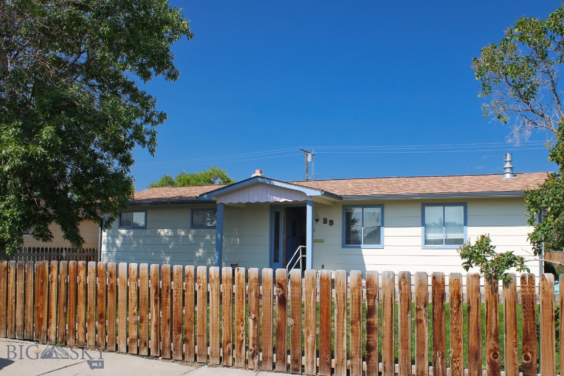 Welcome home to 25 S. California Street! This charming 3-bedroom, 2-bathroom home offers 2,112 square feet on a spacious lot located close to schools, downtown Dillon, shopping, and the college. Step inside and you’re greeted by a generous living room, lovely gas stove, and lots of natural light. The kitchen overlooks the backyard and flows effortlessly into both the living room and a large dining area. Step out onto the Trex style deck right off the kitchen and enjoy outdoor living overlooking a lush, park-like backyard. The perfect setting for gatherings or quiet evenings watching the sunset. With underground sprinklers, this yard is easy to maintain! The main level features a blend of new flooring and original hardwood, adding warmth and character throughout. An updated full bathroom complements the oversized primary bedroom and adorable second bedroom. The fully renovated lower-level offers a generous living/den/office area, a sunny private bedroom & walk-in closet, and two egress windows that bring in tons of sunlight. The spa-inspired bathroom is a true retreat, complete with a generously sized steam shower, deep soaking tub, and ample space for storage and personalization. Additional highlights include a large dedicated laundry area, separate mechanical room with gas water heater, gas furnace, and updated Square D electrical panel. The detached two-car garage connects to the home via an enclosed breezeway, a welcome feature during snowy Montana mornings. Your four-legged friends can roam free in the fully fenced yard. This home is warm, welcoming, and ready for the next owner to enjoy. Call today for a showing!