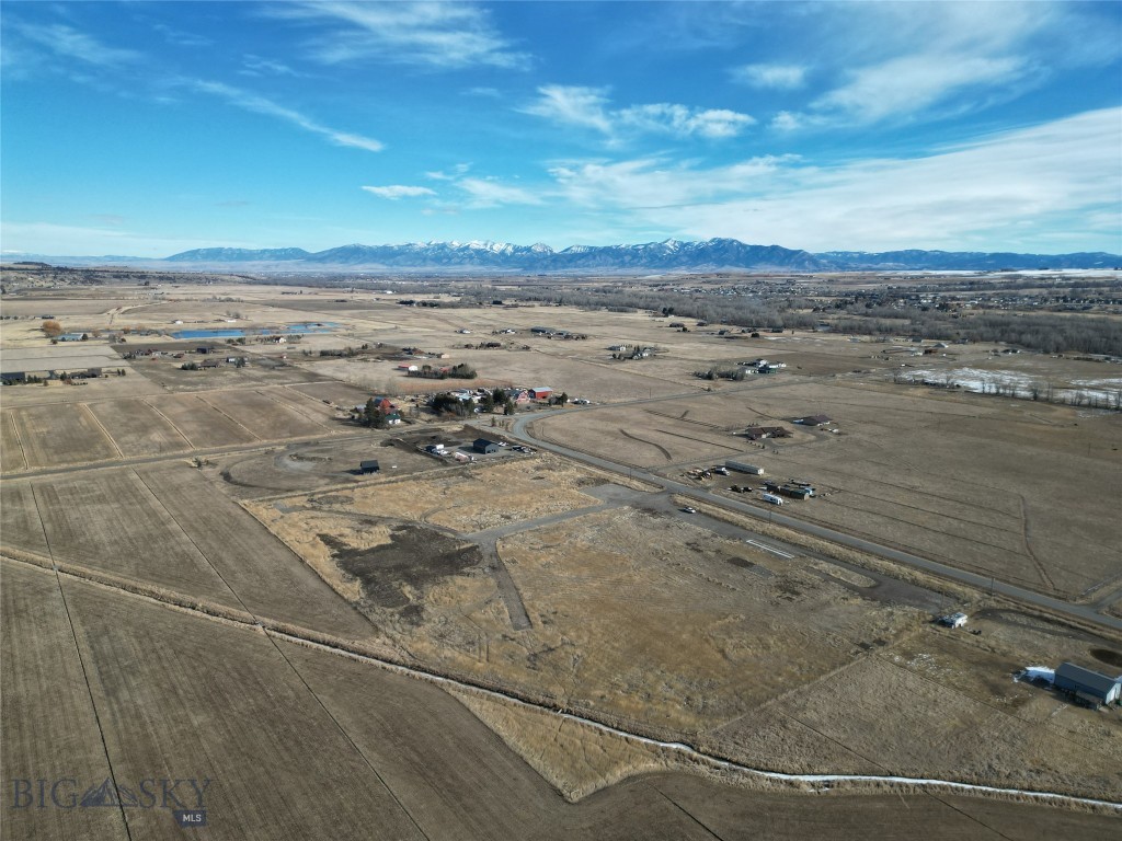 Rare opportunity to own 13.03 acres in the heart of Gallatin Gateway with sweeping views of the Spanish Peaks. Situated on a quiet road, this exceptional property offers the space, privacy, and scenery that define the Montana lifestyle. A COSA rewrite allows for up to three residential homes plus a commercial space, creating incredible flexibility for a private estate, family compound, investment property, or Montana-based business opportunity. With utilities already in place to the lot, much of the groundwork has already been completed for your future vision. Whether you're dreaming of building a Montana retreat surrounded by mountain views, developing multiple homes, or establishing a business in one of the valley’s most sought-after areas, this property offers a rare combination of location, acreage, and possibility. Opportunities like this in Gallatin Gateway are increasingly hard to find.