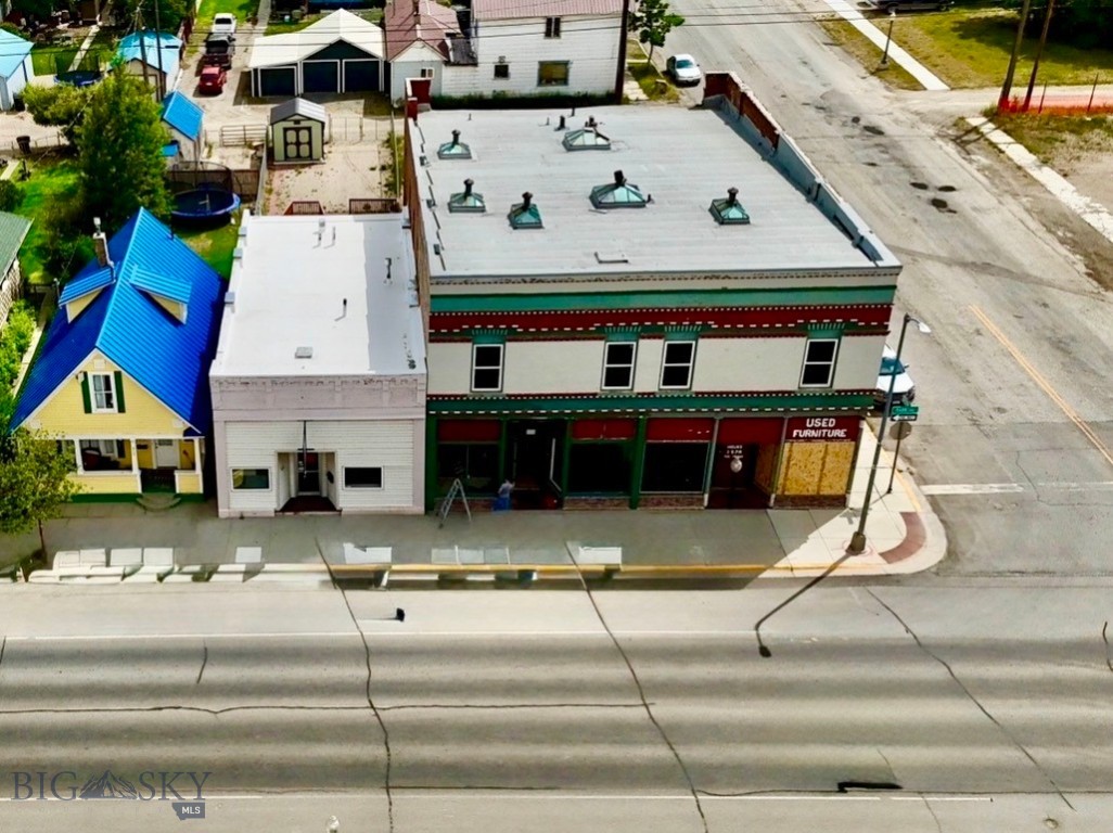 Commercial Building with Attached Residential Living in Downtown Anaconda 
Position your business for success with this exceptional mixed-use property located at 605 East Park Avenue in the heart of historic Anaconda, Montana. Offering commercial storefront space, an attached residential apartment, and a full basement, this property provides outstanding flexibility for owner-operators, investors, or entrepreneurs.
The main level features a bright, clean retail storefront with excellent visibility along Park Avenue, generous display space, and ample storage. Whether you're opening a retail shop, office, gallery, or specialty business, this location offers outstanding potential. (Business inventory is not included.)
Above the storefront is a comfortable two-bedroom residence featuring a spacious primary bedroom with a large walk-in closet, full bathroom, living room, kitchen, hallway storage, and access to a large rear deck overlooking the backyard. A quality Montana Structures storage shed is included, along with the refrigerator, stove, and microwave. 
The basement provides additional storage, a private office or bonus room, a half bath, and washer and dryer hookups, creating valuable workspace and operational flexibility. Significant property improvements include updated plumbing, updated electrical with separate residential and commercial services, updated windows, a Hypalon roof approximately 10 years old, and a forced-air heating system updated within the last five years.
Located just minutes from Georgetown Lake, Discovery Ski Area, Old Works Golf Course, and within walking distance of Washoe Park, shopping, restaurants, and schools, this property offers an outstanding opportunity to live and work in one convenient location while enjoying everything Southwest Montana has to offer.