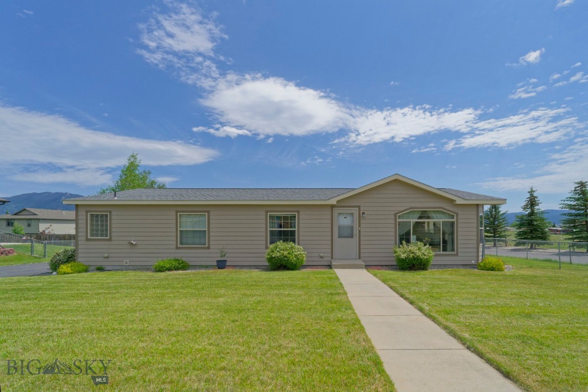 Property is a 2008 detitled manufactured home on a permanent foundation with a detached two car garage. It is in a well kept and quiet neighborhood with two "hobby farms" across the street. To the south is a large vacant lot to -no neighbors! The interior is well kept with new appliances and it has an open floor plan with the living and dining room. There is a large pantry closet in the hall immediately outside the kitchen. Down the hall are three bedrooms including the Primary Bedroom with large space and bath with a walkin shower. Another bedroom completes bed space and there is an additional bath with a shower. The exterior has a new roof and siding and landscaped yard with underground sprinkling and a vinyl privacy fence. In addisiont there is a patio with a gazebo and the house has central air conditioning.  This can be "one level living" at its best.