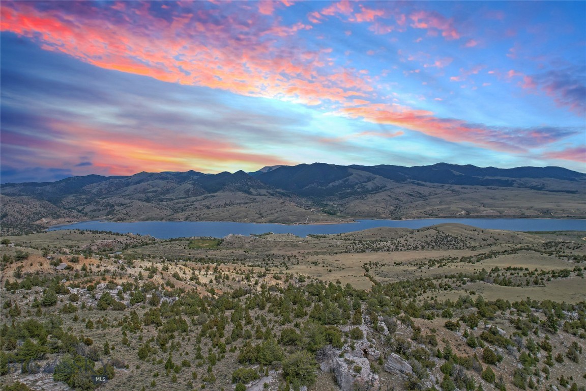 Perched in the heart of Southwest Montana’s famed Ruby Valley, this spectacular parcel offers a place to escape the noise and immerse yourself in 287+ acres of premier recreational land. Designed by nature as a sanctuary for local wildlife, this property is a dream come true for hunters, conservationists, and outdoor enthusiasts alike. Bordering BLM lands and functioning as a natural thoroughfare for resident populations of elk, mule deer, and antelope, this acreage provides an immediate, private launchpad for hunting, hiking, and backcountry exploration. Property has good road frontage off of Garden Creek Road only about 3 miles off of the highway.  Multiple building sites with unobstructed, panoramic views of the glistening waters of the Ruby Reservoir, framed beautifully by the surrounding mountain ranges. Build your dream off-grid cabin or a luxury mountain estate on any of the elevated benches, and secure a rare piece of the last best place.