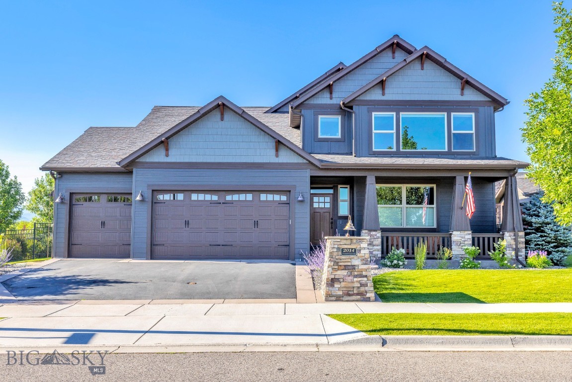 Thoughtfully designed and meticulously maintained, this exceptional residence combines timeless craftsmanship, spacious living, and a wonderful south-side Bozeman location close to MSU, schools, shopping, and recreation. Inside, soaring two-story vaulted ceilings and expansive windows fill the home with natural light, creating a warm and inviting atmosphere. The open-concept living and dining areas are enhanced by a striking floor-to-ceiling rock fireplace with custom wood accents, offering the perfect gathering space for entertaining or cozy Montana evenings. Throughout the home, you'll find quality finishes, including alder wood floors, hardwood cabinetry, solid-wood interior doors, and extensive six-inch trim work. The spacious kitchen is designed to impress, featuring dual ovens, a cooktop, abundant counter space, and an expansive walk-in pantry. The main level offers a generous primary suite, an additional bedroom, a dedicated office (or another bedroom), a laundry room, and two full bathrooms, providing flexibility for a variety of lifestyles. Upstairs, a large bonus room showcases breathtaking, unobstructed views of Bridger Mountain, along with two additional bedrooms and a full bathroom. Outdoor living is equally impressive with a covered east-facing patio ideal for relaxing or entertaining, complete with wiring for a hot tub and outdoor speakers. The beautifully landscaped yard includes mature trees, manicured lawns, a charming greenhouse, and raised metal garden beds. Additional highlights include air conditioning and a true three-car garage with sealed epoxy floors, ample storage, and cabinetry.