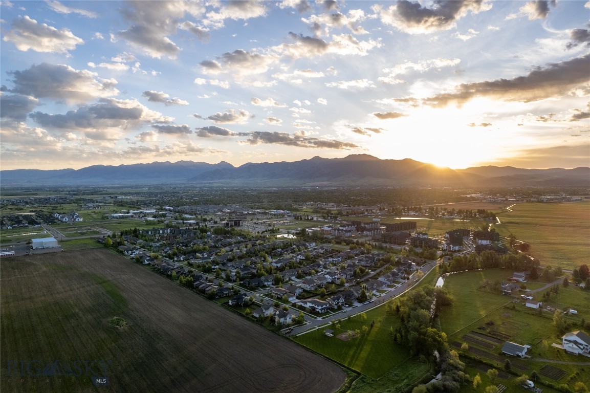 The last available vacant lot in Loyal Gardens sits directly across from an expansive common space backdropped by views to the Bridger Mountain Range. With numerous water features and walking paths winding through aspen groves, this subdivision has a sense of rural living while being right in the heart of Bozeman community. This matured neighborhood is right across the street from numerous dining options, a bank, grocery store, coffee shop, and one of Bozeman’s finest athletic clubs, all seconds away. Zoned RA, this corner lot provides a rare, ready-to-build investment opportunity with up to a duplex plus an ADU that could all have separate entrances. Perfect for live/rent situations or for investors looking to provide a luxurious rental experience within numerous units. Check out the property video tour and then drive on by!