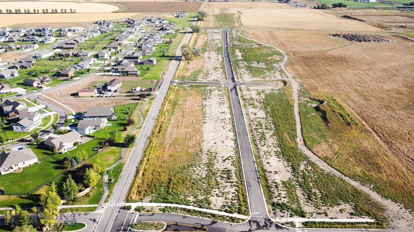 Manhattan Meadows, a premier homesite offering the perfect blend of space, scenery, and small-town Montana charm. Set within one of Manhattan’s newest subdivisions, this spacious lot provides the ideal foundation for your custom home. Whether you’re dreaming of modern farmhouse, traditional ranch, or a contemporary Montana design, this lot will accommodate it! Enjoy wide-open Bridger views and the peaceful setting that Manhattan is known for. With level terrain and convenient utility access, this lot is truly build-ready. Manhattan Meadows offers a thoughtful neighborhood layout, paved roads, and easy access to schools, dining, and the local grocery while still being only minutes from I-90 for quick trips to Bozeman, the airport, or outdoor recreation.