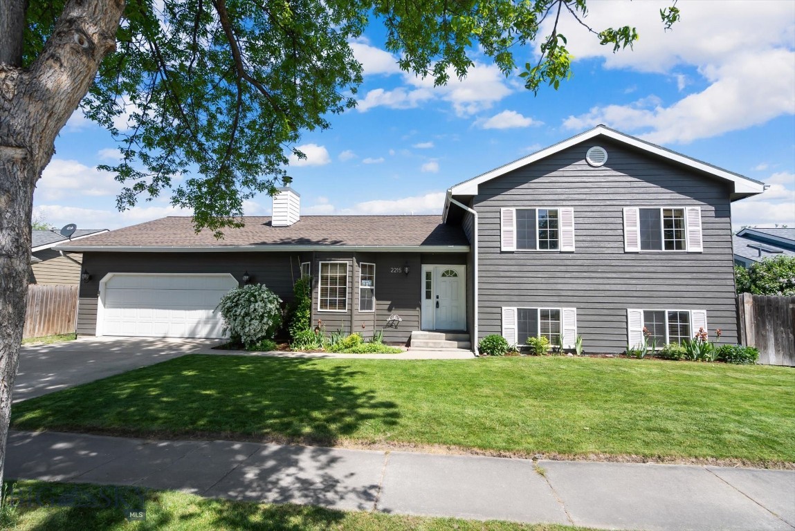 Beautifully updated and move-in ready, this spacious Kalispell home offers 2,191 square feet of comfortable living space with 4 bedrooms and 2 bathrooms. Enjoy stunning mountain views and a private, beautifully landscaped backyard complete with garden beds, 2 pear trees, 2 apples trees, blackberries, raspberries & strawberries, and a cozy upgraded deck—perfect for relaxing or entertaining.

Inside, the open-concept floor plan is filled with thoughtful upgrades, including fresh interior paint, upgraded beamed ceilings, and a warm wood-burning fireplace in the living room. The chef-inspired kitchen opens seamlessly to the family room and features quartz countertops, tile backsplash, new soft-close white cabinetry, stainless steel appliances, and a farmhouse stainless steel sink.

Both bathrooms have been tastefully updated with quartz countertops, tile backsplash, modern fixtures, and new soft-close cabinetry. The oversized bedrooms offer generous closet space with custom organizers, while the huge downstairs bonus room provides endless possibilities for a family room, recreation area, or home office.

Additional highlights include a spacious laundry area, attached 2-car garage, and a heated workshop for hobbies or extra storage. Located in the sought-after Rankin School district, this home combines comfort, style, and functionality with so much more to offer!