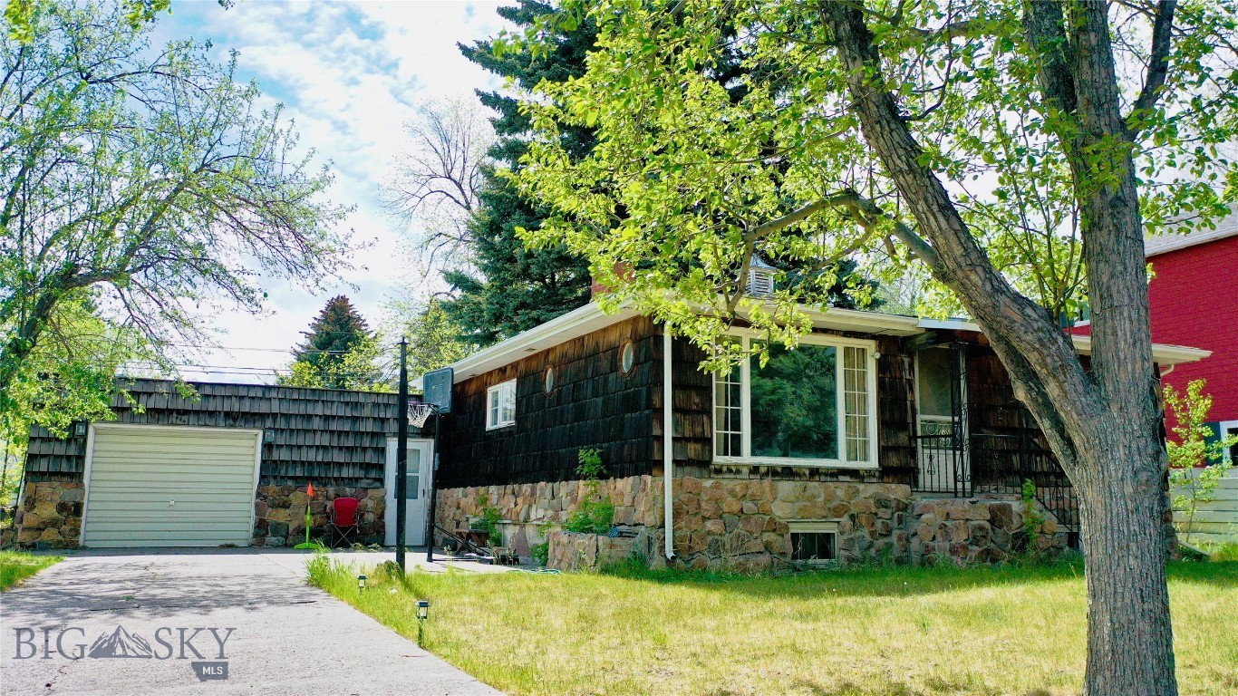 Step back in time with this charming 1940s 3-bedroom, 2-bath home situated on an expansive four city lots in one of Livingston’s most desirable locations. Just blocks from downtown Livingston, a stones throw to the Yellowstone River, and directly across the street from Water Works Park, this property offers a rare blend of vintage character, space, and convenience.

Filled with timeless details, the home feels like a true time capsule with arched doorways, rich knotty pine paneling, built in dressers, custom round windows in both the living room and front door, and classic Dutch doors that add warmth and personality. Outside, enjoy mature apple trees, a concrete driveway, one-car garage, and a stunning custom rock outdoor fireplace perfect for Montana evenings under the stars.

With ample outdoor space across four city lots, this property offers endless possibilities while preserving the nostalgic charm that makes it truly one-of-a-kind. The two Southern lots are taxed separately and easily could support another dwelling.  

Whether you're looking for a full-time residence, vacation getaway, or investment opportunity, this distinctive Livingston home captures the spirit of Montana living.