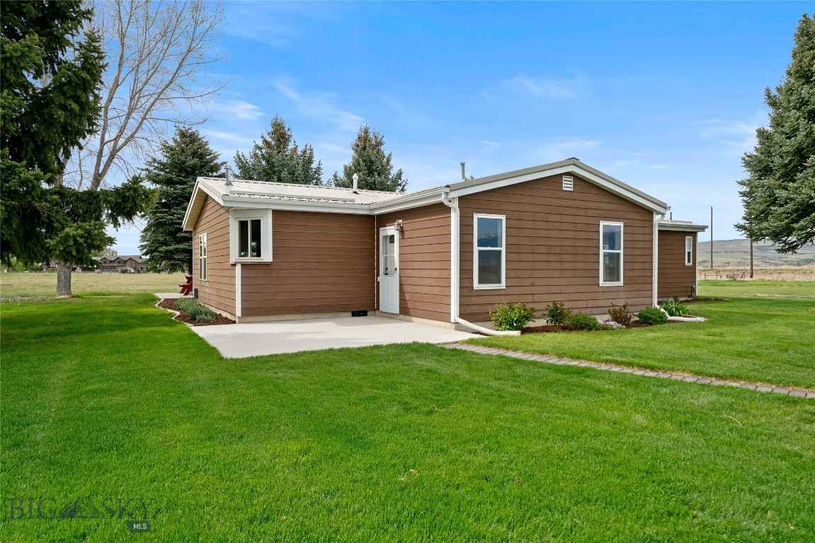 Set on 4.89 fenced acres (bring your horses) with expansive Bridger Mountains views, this 3-bedroom, 2-bath home offers 1,808 square feet of comfortable living space with room to spread out both inside and out. A flexible bonus room is ideal for a home office, hobby space, or playroom. The home features new flooring throughout, updated appliances, remodeled bathrooms, and a spacious primary bath with a granite countertop and a soaking tub.
Enjoy multiple gathering spaces including a cozy reading room with a wood-burning and a gas burning stove off the living room added warmth and character. Central A/C provides year-round comfort. Outside, mature trees, front and back patios, and a setting tucked well off the road create a quiet rural atmosphere with open views in every direction.
The large approximately 49’ x 28’ shop/garage provides excellent space for projects, storage, vehicles, trailers, campers, and recreational equipment. You can also park trailers, campers and toys outside. Perimeter fencing and open acreage offer flexibility for a variety of uses. Private well. Surrounded by open farmland and wide-open skies, this property delivers the space and peaceful setting many buyers are looking for.