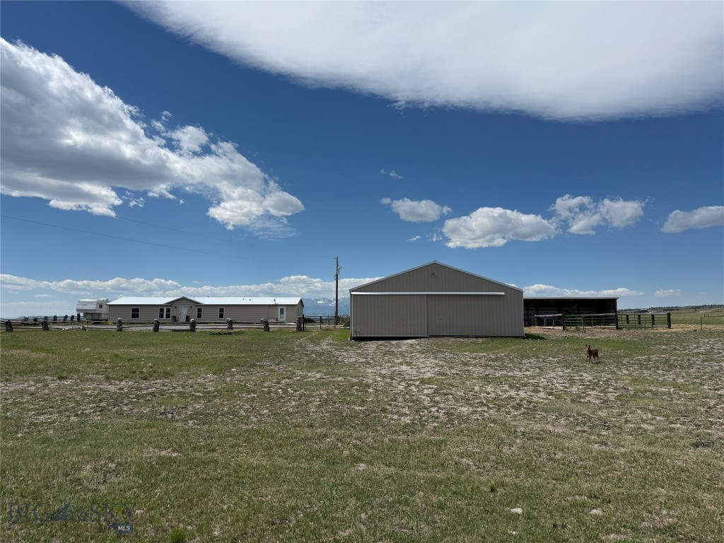 Horse Property with Spectacular Mountain Views on 20 Acres Near Big Timber, Montana. Horse owners and outdoor enthusiasts, don't miss this exceptional opportunity to own 20 scenic acres just minutes from Big Timber. This versatile property offers room for horses, livestock, equipment, and endless possibilities while showcasing breathtaking views of the surrounding mountain ranges. This 2,080-square-foot manufactured home, built in 1999, features 3 bedrooms, 2 bathrooms, a spacious kitchen, dining area, comfortable living room, and a large mud room with office designed for country living. Step outside and enjoy the beautiful Montana landscape from the generous 16' x 20' deck. The property is fully equipped for livestock and equipment needs with numerous outbuildings, including a 36' x 30' two-car garage with workshop, a 36' x 48' enclosed metal barn/shop, a 16' x 48' open-front livestock shelter with loading ramp, and a storage garden shed. The acreage is perimeter fenced and suitable for horses and other livestock. The land has previously been utilized for dryland hay production. A reliable well producing approximately 12 gallons per minute supplies the property. Enjoy panoramic views of the majestic Crazy Mountains to the west and the Absarokee and Beartooth Mountains to the south. Whether you're seeking a horse property, hobby farm, or peaceful country retreat, this property offers outstanding value and unlimited potential.