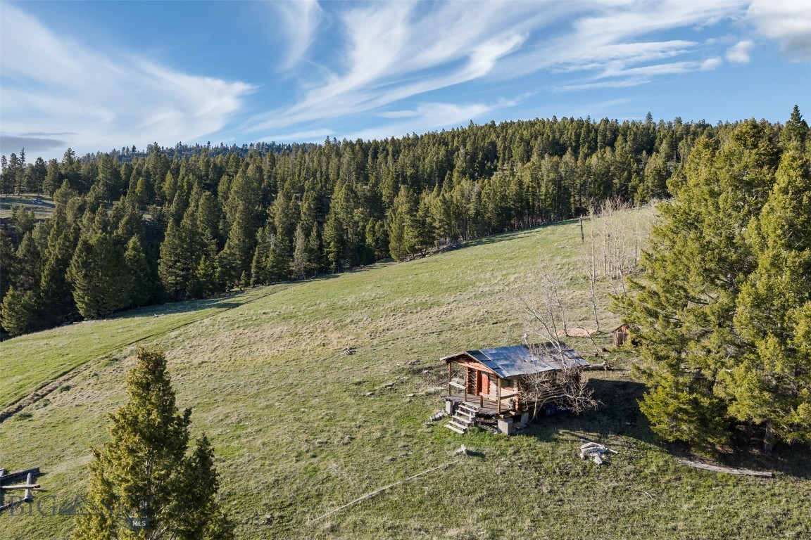 Tucked away deep in the mountains of Montana, this beautiful 20-acre off-grid getaway is the kind of place people dream about when they want to truly unplug and escape the noise of everyday life. Conveniently located between Helena, Missoula, and the Seeley-Swan Valley, the property offers an incredible mix of privacy, scenery, and recreation. The land features a perfect balance of timber and open pasture, with breathtaking views in every direction. Chimney Creek runs through one corner, adding to the peaceful mountain setting. Wildlife is everywhere-deer, elk, moose, and more regularly roam the area making this an ideal retreat for hunters, outdoor enthusiasts, or anyone who simply loves being surrounded by nature. Completely off-grid and surrounded by wilderness, this property offers a rare opportunity to slow down and enjoy the simple things. If you’ve been searching for a private recreational retreat with incredible beauty, solitude, and endless outdoor adventure, this Montana mountain property is something special. Seasonal access only.