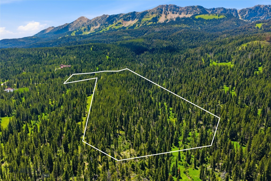 Space is the ultimate luxury... And the ultimate bespoke experience may be combining one's unique vision of home with a truly enchanted piece of property in the great expanse of Montana’s Northern Rockies. A sublime offering in the heart of Bridger Canyon, a prestigious yet authentic retreat minutes from the cultural boomtown of Bozeman, Montana. Nestled against the backdrop of Ross Peak, with views of the Bridger and Bangtail Mountains, this property delivers the very essence of tranquility and privacy. The renowned Bridger Bowl, one of the best non-profit ski area in the country is just a stone’s throw away. The property borders National Forest Service and has direct access to Cross Cut Nordic ski area while Brackett Creek winds its way through the property. Adventure awaits right at your doorstep. This 17+ acre property is a canvas of forests, meadow, water and private forest service access awaiting your inspiration. Simply the most spectacular land offering in the area in years. Only lot 30 has direct private access to hiking, biking, and skiing on adjacent Crosscut trails and directly to adjacent National Forest trails. In addition, there is hiking and ski touring access on 100+ acres of Ross Peak Ranch’s open space. Don’t miss your chance to own this extraordinary piece of Montana and create a legacy for generations. Contact us today to schedule a viewing and discover the endless possibilities that await you on this magnificent property.