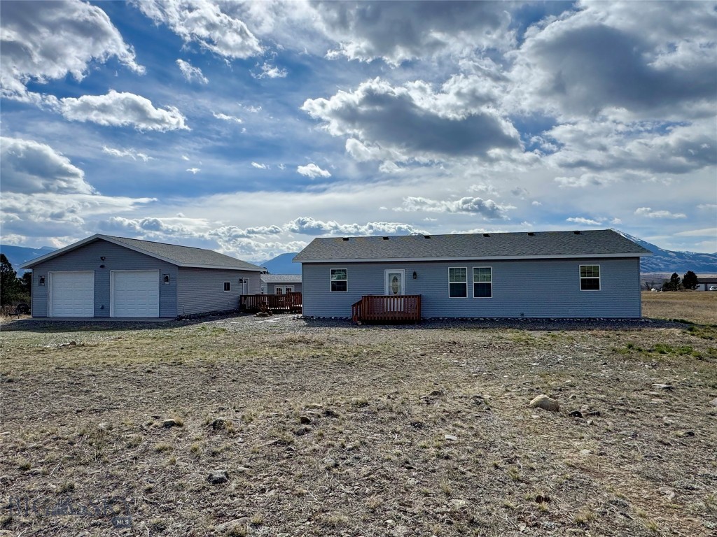This 4+/- acre Paradise Valley property has astounding views looking over the Yellowstone River valley at the majestic Absaroka Mountains towering above. Located about 18 miles south of Livingston, this one owner 1456 +/- SF house is clean, well maintained and has that cozy feeling so ideal for rural living. The spacious kitchen invites home cooked meals, while the open living/dining area offers comfort and relaxation. The primary bedroom has plenty of room for a king size bed, with an ensuite full bath. A guest bedroom, second bath and laundry area compliments the living area. A nice sized walk-out deck looks over the valley to the south - perfect for enjoying nice peaceful days and entertaining guests. A 28' x 36' detached 2 car garage allows for plenty of storage and workspace, and a separate site-built shed provides additional room for storage, crafts or hobbies. With light covenants, the property has potential for a variety of uses and is ready for its second owner.