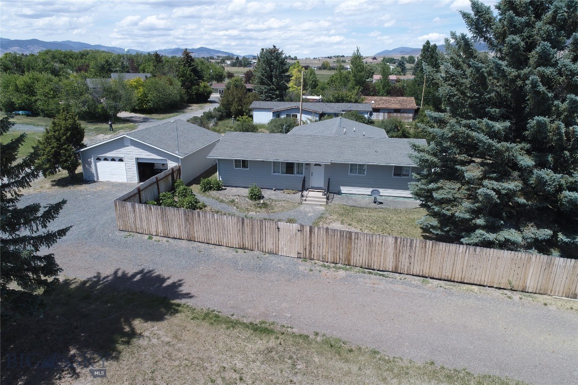 This well-kept and partially remodeled home is spacious and ready for you! One level living features 2 bedrooms and a bathroom on one end of the home, a large living area, modern kitchen and dining area, primary ensuite bedroom with an attached room that can be used as an office, nursery, workout room -- whatever you want!  The large mud room/laundry room could also be fashioned into an exercise area, rec room, or family room!  Recent improvements include newer flooring and trim, some newer doors and paint, bathroom remodel, new water heater and water softener, newer appliances, and a privacy fence!  Outside, the oversized 30x28 garage offers space for your vehicles and toys, while the 0.77 acre lot gives you tons of space for your furry friends!  A large privacy fence gives you a safe play space, and additional non-landscaped areas offer ample opportunities for animals or other needs.  There are even 4 RV hookups available for possible use! All this just outside of the quaint town of Whitehall, Montana!