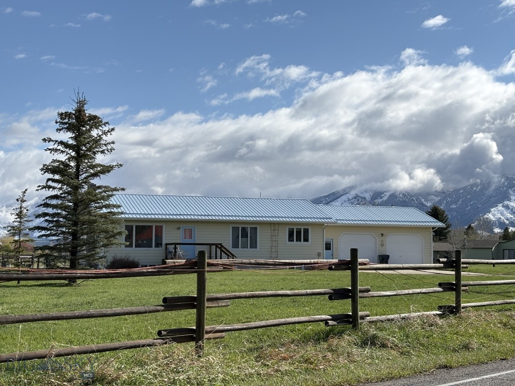 This delightful one owner home is a rare offering set on 18.49 acres of useable land fenced for livestock and no known covenants. Being Located on a paved county road provides fast easy access to Bozeman or the airport in Belgrade . There may be potential to subdivide the property or add facilities for an equestrian setup or home business. East Gallatin Zoning Regulations apply.  The basement apartment works great for friends and family to visit and has been rented briefly in the past. The oversized garage provides extra space for work bench and storage. The high yield well was pump tested at 60 gpm and the owner has a recorded water right that will transfer to the new owner. There are great views of the mountains and deer occasionally wander through. Soils in the area are known to be very productive for pasture, raising hay or grain.  Property is adjacent to Outlaw Subdivision on the East side and homes on 20+ acre parcels to northwest. Additional information and supporting documents can be found in "View Documents" on the listing. All information provided is from sources deemed to be reliable however potential purchasers are advised to complete their own investigation.