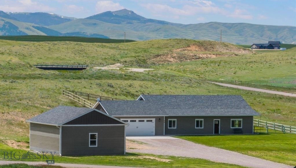 Come take a look at this beautifully maintained 3-bedroom, 2 bath home featuring 1,816+/- square feet of comfortable one level living space w/2 car attached garage (approx. 23' x 26.5') on 3.626 acres. Incredible panoramic views of the surrounding mountain ranges, this property is in the peaceful Sweetwater rural setting and only 5 minutes to town. Enjoy the comfort of the open concept living w/vaulted ceilings in the living, dining and kitchen area…..great for entertaining and hosting family gatherings. This home is thoughtfully designed with 9’ walls throughout, large windows in every room, an exceptional kitchen featuring stainless steel appliances, granite countertops w/bar seating, ample counter space and custom cabinetry. Home is heated with a propane forced air furnace, cooled with central AC and also comes with a water softener and window blinds throughout.  Enjoy the covered front porch rain or shine….it’s perfect for relaxing with a cup of coffee in the morning to watching a thunderstorm move through the valley. Well maintained landscaped yard with underground sprinklers and fenced back yard for your furry friends. This property also features a 1,008 SF (approx. 27' x 37'4") insulated and drywalled shop with a 12x10’ overhead door….ideal for those needing extra pace for toys, storage or projects. This is a must see property…..with 3.6+ acres there is room for animals.  Country living yet close to town. Call today to schedule your private showing.