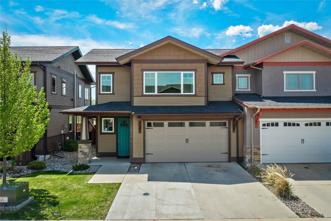 Enjoy mountain views and convenient access to Bozeman amenities from this clean and move-in-ready 3-bedroom, 2.5-bath townhome. With 1,851± square feet, this property combines comfortable living spaces with quality finishes throughout.

The home features quartz countertops, stainless steel appliances, a gas range, and a striking double-sided gas fireplace. A convenient half bath is located off the downstairs hallway.

Upstairs, the spacious primary suite includes a bathroom with a double vanity, separate toilet room, and generous storage. Two additional bedrooms capture beautiful mountain views and share a 3/4 bathroom with double vanity and separate toilet room.

Enjoy outdoor living from the covered back patio overlooking the fenced backyard and southern mountain ranges, with a walking trail located just beyond the fence line. There is also a hot tub to soak in after a great day of skiing at Bridger Bowl which is only 19 miles away. Additional highlights include a freshly painted interior, tile bathroom floors, carpeted upstairs bedrooms, and a super-clean 2-car garage with epoxy flooring.

Conveniently located less than a mile from Costco, Target, and WinCo, approximately 4 miles from downtown Bozeman, 5 miles from MSU, and 7.5 miles from Bozeman Yellowstone International Airport.