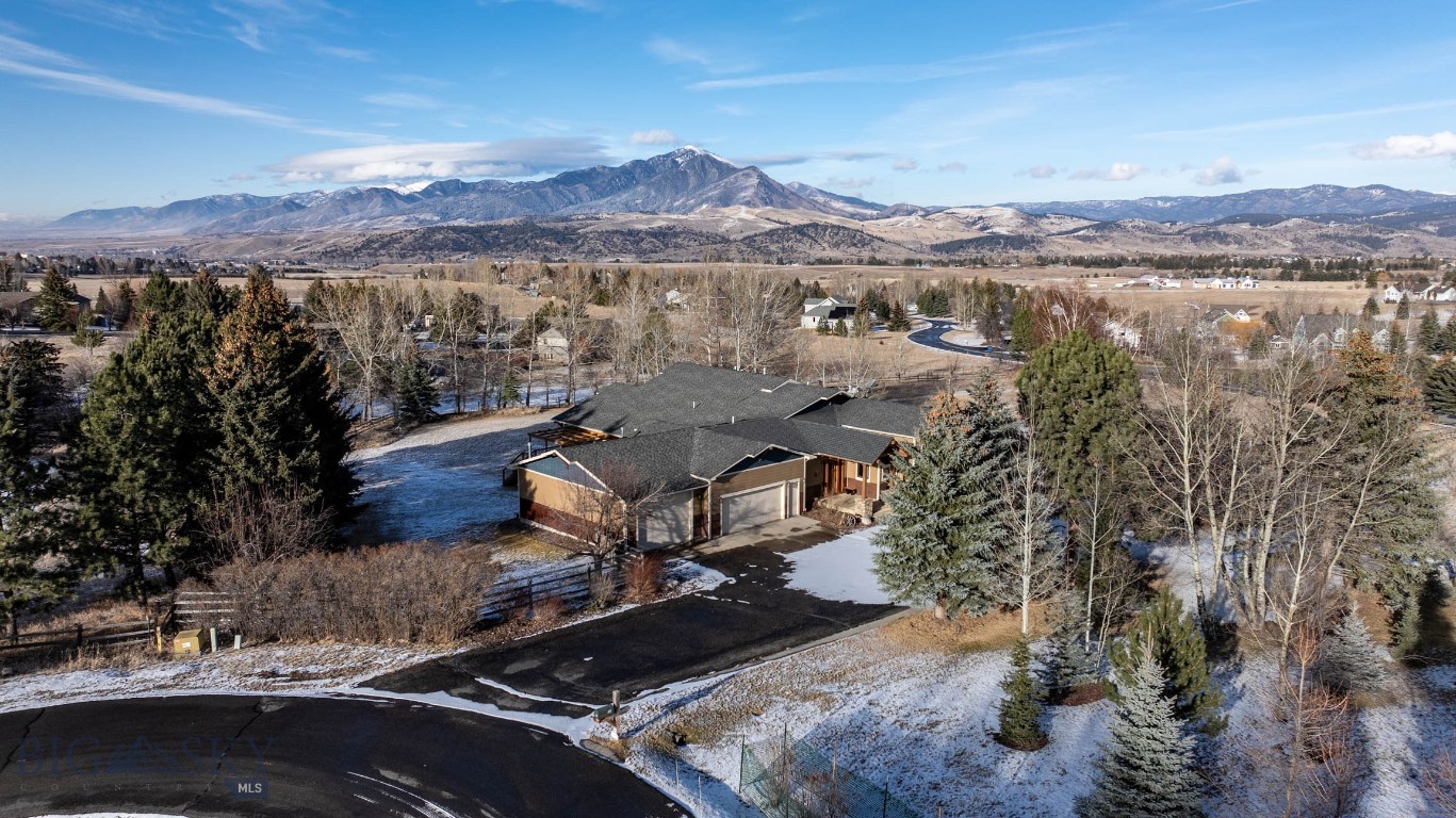 Welcome to this exceptional custom estate, offering rare space, privacy, and versatility at the end of a quiet cul-de-sac on 1.9 beautifully maintained acres.
With over 6,100± square feet of thoughtfully designed living space, this home seamlessly blends comfort and craftsmanship. An open-concept floor plan is enhanced by rich Brazilian cherry hardwood floors and high-end custom carpentry throughout. The expansive great room impresses with soaring vaulted ceilings, a dramatic stone gas fireplace, and a stunning wall of windows that floods the space with natural light.
The chef’s kitchen, fully remodeled in 2016, features knotty alder cabinetry with soft-close hinges, granite countertops, a generous center island, and stainless steel appliances—perfectly designed for both everyday living and entertaining. A substantial renovation and addition completed in 2008 further elevated the home’s functionality and flow.
The main-level primary suite serves as a luxurious private retreat, complete with its own fireplace, balcony, and panoramic views. Radiant in-floor heating ensures year-round comfort, while custom staircases with wrought iron and alder railings add architectural distinction and elegance.
The walk-out basement provides flexible living space ideal for guest quarters, multi-generational living, or a private suite. The expansive lot allows for a future shop or second home and includes a second entry from Painted Hills Subdivision—offering exceptional flexibility for expansion or separate access.
Outdoor living is equally impressive, featuring new Trex decking (summer 2025), a fully fenced garden with underground sprinklers, an invisible dog fence, a custom firepit perfect for gathering under the stars, and ample room for horses.
A rare blend of luxury, freedom, and future potential—this is a property designed to live boldly today and grow effortlessly with you tomorrow.