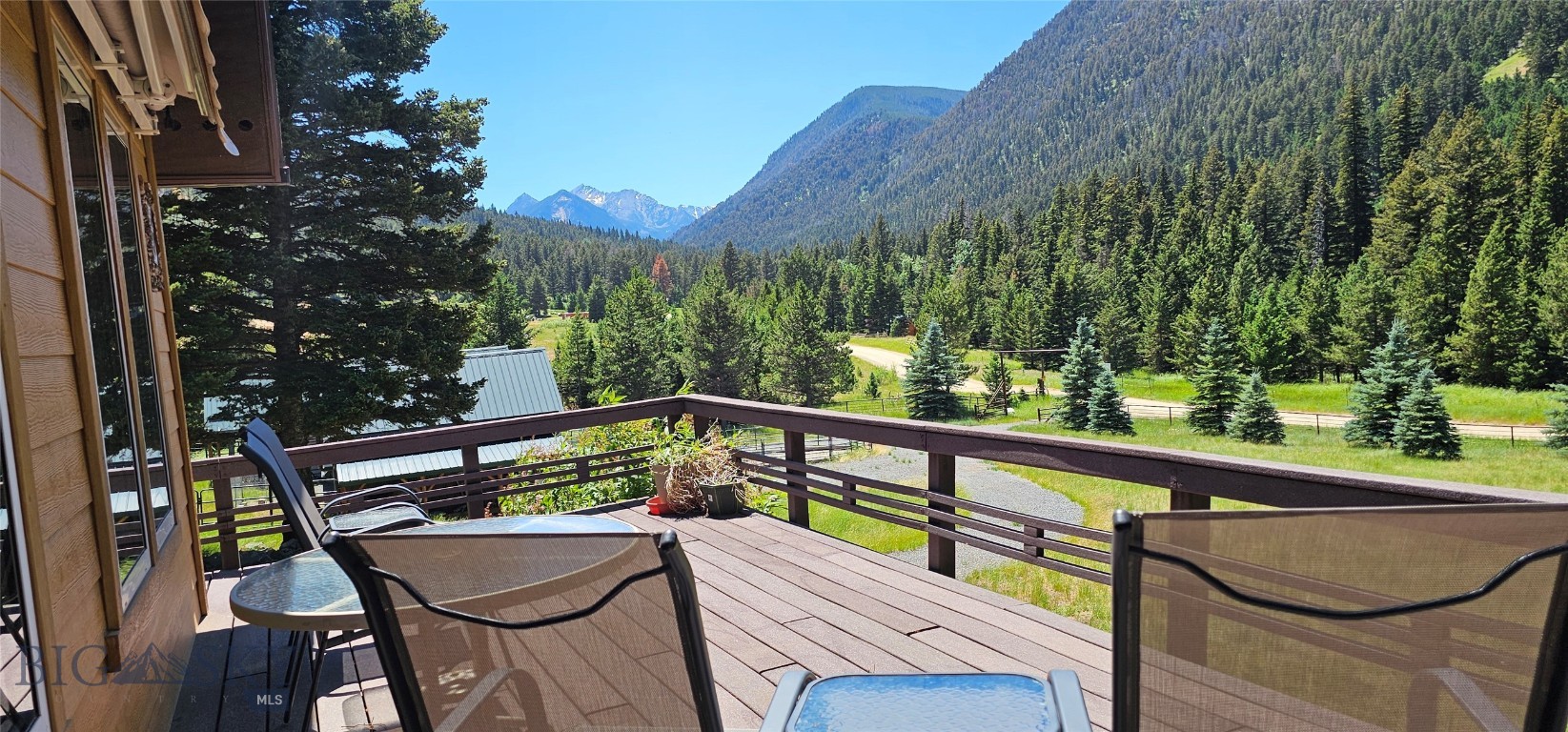 South Boulder Riverfront !! Peaceful Mountain Getaway with Horse Facility in Mammoth, Montana.  Bring your horses and settle into this peaceful retreat tucked away in Montana’s stunning Tobacco Root Mountains. With South Boulder River frontage, this property is the ideal spot for fishing, hunting, outdoor adventures, or simply soaking in the beauty of nature. Step out onto the spacious trex deck and take in panoramic mountain views and watch the wildlife. Inside, the cozy living room is great for relaxing, spending time with friends, or just enjoying the view. The convenient kitchen makes it easy to cook and gather, the dining area opens onto the deck, perfect for BBQs and entertaining. The home features three bedrooms, one of which is a loft-style bedroom also perfect for a home office, reading nook, or creative studio. The property is ready to go with a barn, corrals, a round pen, and plenty of room to ride. The barn also includes a shop area and space to store your horse trailer, tractor, or other gear. Thousands of acres of public land nearby, with scenic trails that wind through wildflower-filled meadows, lead to alpine lakes, and offer sweeping views of the Tobacco Roots. Green house to get an early start on planting. Best of all, the property comes fully furnished—move-in ready so you can start living your Montana dream from day one. Located in the quiet, unincorporated community of Mammoth, just 65 miles from Bozeman and 50 miles from Butte, this is a must-see mountain escape.