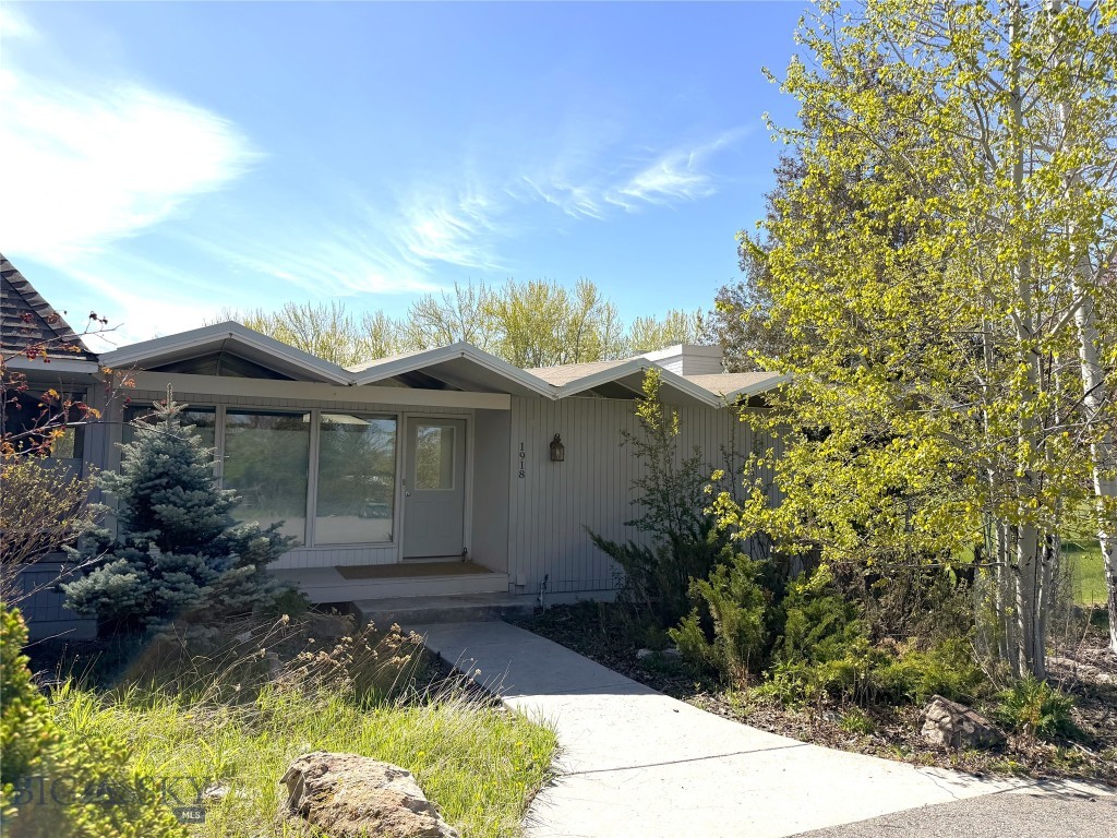 Rare offering of this park-like setting in the middle of Bozeman!  On city services, with nearly two and a half acres of serene property with mature landscape and a creek flowing through, it's a must see.  Whether you're looking for a legacy property or have a desire to do a luxury remodel, this home lends itself to many options.  In very close proximity to Montana State University, Bozeman Deaconess, schools, shopping, trails and so much more, it's all at your fingertips here ... and you can have an incredible private backyard experience with Montana wildlife frequently visiting as well.  There is an abundance of natural light and Southern exposure with this home, you'll love it!  With an open and inviting main floor living room, plus an additional flex space, this home offers many options and is a must see!  Please make note that some of the rooms are non-confirming and closets are located in the hallway.  However, there are plenty of options to make this home whatever you can imagine!  With updates throughout the decades, this modern mid century home offers unique architectural design elements and pulls in Montana's beauty, in the heart of Bozeman.
Please make note that listing agent has ownership in property.  This is also listed as an option with the adjoining approx. 1.396 AC parcel for a total of approx 3.868 AC as MLS#409414