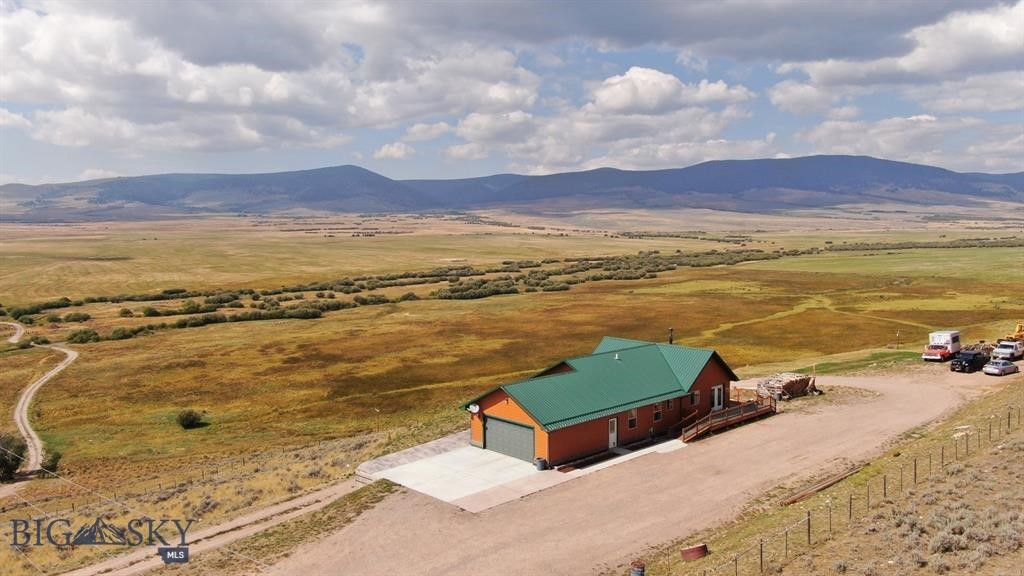 LIVE / WORK residence and business opportunity in Southwest Montana's Pioneer Mountains in Polaris, west of Dillon!

Perched high overlooking Grasshopper Creek and miles of timbered high country in the Beaverhead-Deerlodge National Forest including multiple high peaks and miles of public lands trail access.  Spectacular, panoramic mountain views, and close proximity to Maverick Mountain Ski Area and Elkhorn Hot Springs.  Approximately 30 miles to Dillon and 40 miles to Wise River.

The well-appointed residence is set up with two separate floors, each with independent kitchen and bathrooms, making the property ideal for short or long-term rental, outfitter quarters, or simply a wonderful home with separate living space.  Detached greenhouse has electrical service.  

Property is located in the heart of big game hunting and cattle country.  Business is ideally suited for meat processor, servicing both domestic and wild game animal processing.  The plant is professionally equipped and immaculately clean.  Offers big game transport "meat frozen and delivered to your door" service.  
Turn-key business includes client list, state-registered trademarks and recipes, plus all FFE, including refrigerator units, walk-in freezer, sinks, tables, slicers, smoker and all required equipment.  Detailed fixtures & equipment list is available upon request.  Business has dedicated propane, and shares electric and water with residence.  Residence has wood stove and electric heat.  Business is approximately 1890 square feet.  Home was built in 2008, and business in 1998.

Land line telephone and fiber optic service is provided by Southern Montana Telephone;  T-Mobile tower and Starlink services available.  Location offers great commercial visibility and access year-round, yet property is set off the highway for privacy and views.

Property listing information deemed accurate;  however, buyers are encouraged to verify the accuracy of all details.