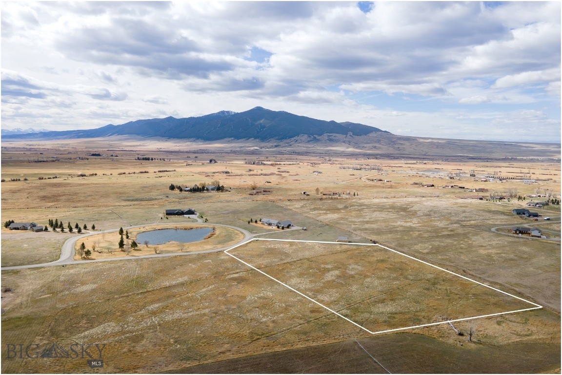 A premier 5.5 acre lot in the sought after Homestead Subdivision which is known for its tidy homes and dramatic views of the surrounding mountain ranges. This acreage has water rights and is at the back of the subdivision with two sides bound by open land for your privacy.  These lots have power, phone, high speed internet and natural gas to each one, just bring your house plans.  Note that the lot also abuts the common area pond for your continued enjoyment for recreation. You're welcome to bring your 4 legged friends or just soak in the peaceful setting. Close to public land and world class fly fishing in the nearby rivers and streams or take a hike to the mountains in all directions.