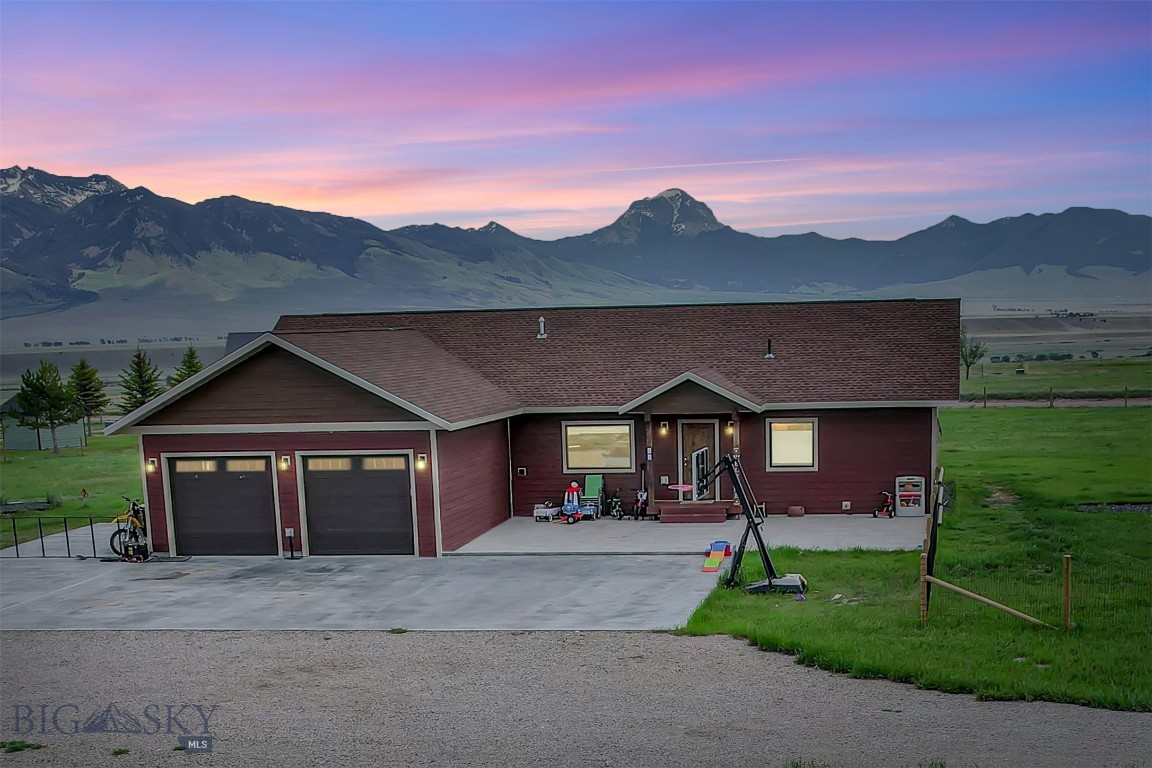 This home is positioned on the bench giving it forever unobstructed views of the Madison Mountains as well as a great view of the valley! This single level home has large vaulted ceilings with an open floor plan and separate living areas. The master bedroom is on one end of the house and the guest bedrooms and bath are on the other side of the home. The master bedroom is a nice size, has his and hers walk in closets, tiled master bathroom with double vanity, tiled walk in shower and nice sized soaker tub. The kitchen has a double oven propane range, hidden dishwasher, hidden trash can, soft close cabinets and custom silverware and knife block drawers. There is a covered concrete stamped patio out the double french doors, stamped concrete patio out the front with an additional large concrete pad extending across to the double car attached garage. Most of the property is fenced with woven wire to help contain your four legged critters or kids. This home is located in the heart of recreational paradise with the Madison River being less than 2 miles away, quick drive to the Call Road to access the Gravelly Mountains and easy access across the Cutoff Road to get on the Madison Mountains trail systems! In Montana you don't just buy a property you purchase a lifestyle!