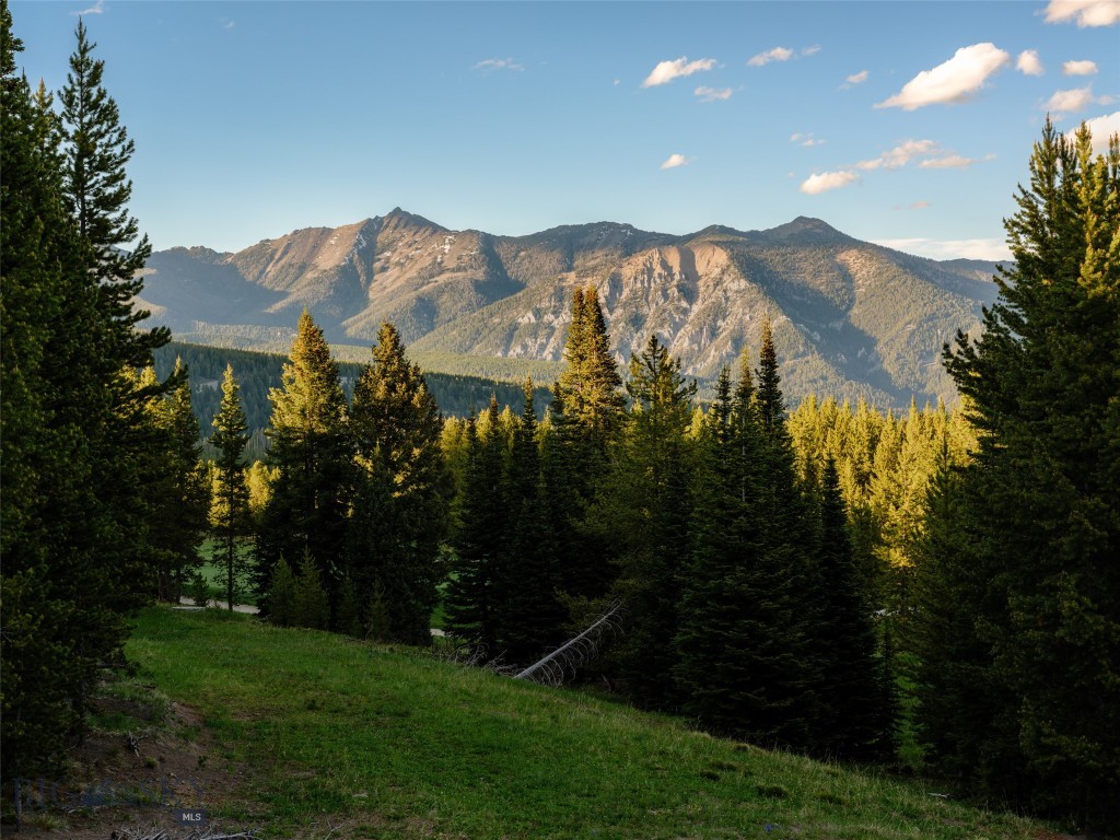 Elkridge Lot 30 presents one of the finest View, Ski, Golf & Location opportunities within Spanish Peaks Mountain Club to create a truly exceptional mountain estate. Encompassing approximately one acre, this premier homesite is ideally positioned at the end of a quiet cul-de-sac, offering privacy, tranquility, and breathtaking, unobstructed views stretching into Yellowstone National Park. Fronting Open Space next to the Tom Weiskopf Signature Golf Course with true ski-in/ski-out access, the property also enjoys direct connections to the community’s hiking and Nordic trail system and is just a short stroll from the Clubhouse and pickleball courts.

INCLUDED with the property are CENTRE SKY architecturally approved plans for an extraordinary seven-bedroom legacy residence encompassing approximately 8,000 square feet of net living area (nearly 10,000 square feet gross). Thoughtfully designed for luxurious mountain living and entertaining, the plans allow a future owner to begin construction without the time and expense of the architectural approval process.

Whether spending winter mornings skiing directly from your door, summer afternoons on the fairways, or evenings entertaining beneath Montana’s endless skies with panoramic views into Yellowstone National Park, Elkridge Lot 30 offers an unrivaled four-season lifestyle. Residents enjoy immediate access to championship golf, world-class skiing, miles of private trails, wellness amenities, exceptional dining, and preferred access to the Montage Big Sky.

A SIGNATURE Golf Membership to Spanish Peaks Mountain Club is available, offering access to one of North America’s most distinguished private mountain club experiences.

A homesite of this caliber—combining an end-of-cul-de-sac setting, unobstructed views into Yellowstone National Park, golf course frontage, true ski-in/ski-out convenience, walkability to the Club’s premier amenities, and approved plans for a landmark mountain residence—is an increasingly rare offering within one of the Rocky Mountains’ most prestigious private communities.