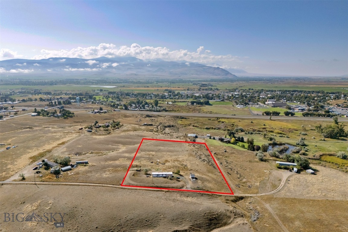 Discover 5.22 acres of country living just outside of Whitehall. This versatile property is set up and ready with sewer, well, electric, and natural gas already in place and connected to a 1974 3 bedroom, 2 bathroom mobile home. The mobile home is not on a permanent foundation, offering flexibility for your plans. Live in the home while you build your dream property, or continue to use it as-is.

The land is perimeter and cross fenced, making it ideal for a hobby farm, livestock, or 4-H projects. A shed on the property provides additional storage for tools and equipment. Enjoy beautiful views and a sense of privacy, all while being just a short distance from town.

Seller is offering a $2,000 credit for buyer to complete a quiet title after closing.

Contact your real estate professional to schedule a private showing.
