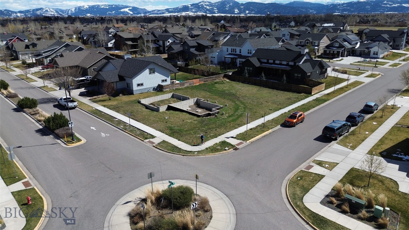 Rare opportunity in Bozeman’s highly desirable Flanders Mill Subdivision! This prime corner lot at Windrow & Annie is one of the last remaining buildable lots in the neighborhood—just two blocks from Gallatin High School and minutes from parks, trails, ponds, and everyday amenities.

What makes this property stand out? The heavy lifting is already done. The sale includes HOA-approved building plans, saving months of design time and fast-tracking your path to construction. Even better, a partial foundation is already in place, creating a unique head start for your future home.

The thoughtfully designed plans showcase a stunning residence positioned to capture beautiful mountain views, blending modern design with functional, livable space—perfect for today’s lifestyle.

Located in one of Bozeman’s most sought-after communities, Flanders Mill offers direct access to trails, open space, and nearby parks, all while being conveniently close to schools (just blocks), shopping, and dining.

Seller financing available, creating flexible options for buyers, builders, or investors looking to secure a premium homesite in a high-demand area.

Skip the delays, avoid the hassle of starting from scratch, and step directly into building your vision. Opportunities like this—corner lot, approved plans, partial foundation, and financing flexibility—are incredibly rare in Bozeman.

Bring your offer and make it yours.