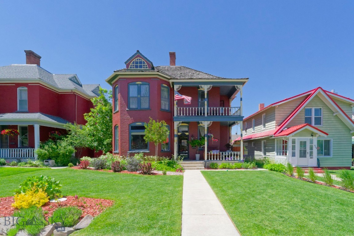 You will be "swept away" by the beauty of this historic home in the Anaconda Original Townsite. Property is an 1890 Victorian home with original woodwork, restored floors and features throughout. From the charming front porch you enter a magnificent entry hall with period wallpaper, fretwork, seating and french door to the lving roomwith a bay window and original light fixture.  A formal dining room is next with a gorgeous chandelier, period woodwork and large windows. Off the dining room is a family room with grey shiplap and main floor bathroom with a walk in shower. The main floor rooms have crown moulding. A butler's pantry transitions to the kitchen and is a coffee bar. An artisits studio shares space with the laundry room.  A remodeled kitchen with high end cabinets and granite counter tops with extensive crown moulding, two tin faced cabinets sustains the historic feel. A tribute to the period is the  "back stairway". A mud room off the kitchen leads to the back yard .If you decide to take the back stairs. the 2nd floor where 4 bedrooms (including a primary bedroom) and a full bath ( with black and white tile) add living space. A study leads to an L shaped balcony. The back yard is leterally a haven with two signle car garages, paver stone patio and mature landscaping. The exterior is newly painted and the back roofs are new. It's location is right off the historic Kennedy Commons with year round activities including the community Christmas tree. The surrounding homes are historical and part of the original townsite.