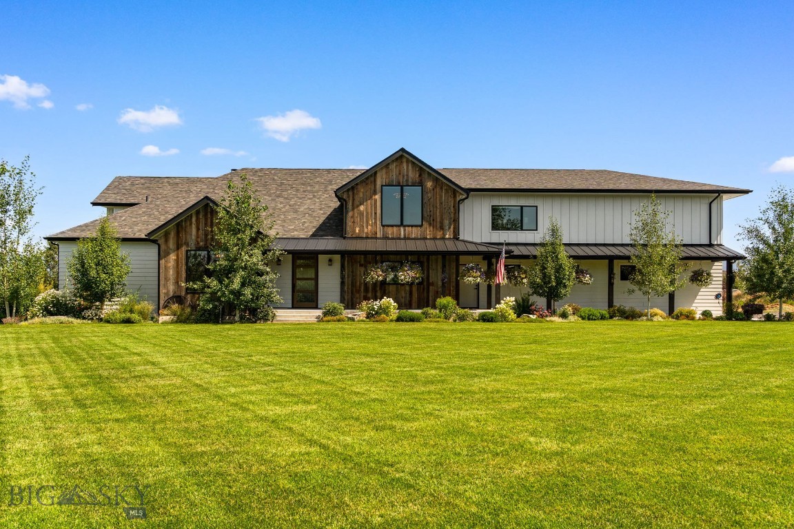 A rare opportunity to experience refined Montana living on your own private sanctuary, perfectly positioned on 5 pristine acres in the highly sought-after Wylie Creek Ranch on Bozeman’s northwest side. Surrounded by open space, mature landscaping, and sweeping views, this property offers an exceptional balance of privacy, scale, and proximity to town.Completely reimagined in 2021, this extraordinary 4-bedroom, 6-bath residence has been thoughtfully redesigned to elevate both form and function. At the heart of the home, a dramatic two-story great room creates an unforgettable first impression, anchored by a custom steel, wood-burning fireplace that serves as both a statement piece and gathering point. Expansive windows draw in natural light and frame the surrounding landscape, seamlessly connecting indoor and outdoor living.Every detail throughout the home has been carefully curated. The interiors showcase all-new custom cabinetry, designer tile selections, and quartz countertops, delivering a cohesive and elevated aesthetic. Hand-forged steel railings line the upper level, adding architectural interest and craftsmanship that carries throughout the home. Each of the four bedrooms features its own private en suite, offering comfort and privacy for both residents and guests, while two additional powder baths—thoughtfully placed on both levels—enhance functionality for entertaining.Designed with hosting in mind, the home offers exceptional indoor and outdoor entertaining spaces. A custom bar provides the perfect setting for gatherings, while the outdoor kitchen extends your living space into Montana’s beautiful seasons. The exterior has been equally elevated, featuring custom barnwood siding, all-new wood windows, and a new roof—blending timeless Montana character with modern performance. An expansive four-car garage offers ample room for vehicles, gear, and all of your Montana lifestyle essentials.
With covenants allowing for an additional outbuilding, the full potential of this five-acre parcel is yours to realize—whether that includes a guest house, shop, or recreational space.Despite its private, estate-like setting, the property remains just minutes from downtown Bozeman, top-rated schools, shopping, and the Bozeman Yellowstone International Airport. This is a location that truly delivers—offering both seclusion and convenience in one of the area’s most desirable communities.