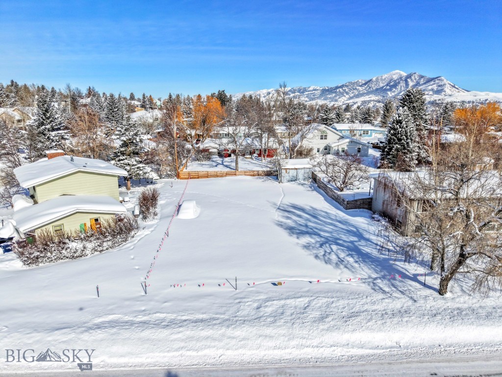 A rare infill lot in one of Bozeman’s most desirable areas! Nestled on the sought-after south side, this homesite offers an unbeatable combination of convenience, recreation, and stunning natural surroundings. Situated just moments from Bozeman Health Deaconess Hospital, Valley View Golf Course and Montana State University, this location is perfect for those who want to be close to it all. Step out your front door and enjoy access to Bozeman’s trail system only a block away- ideal for hiking, biking, and cross-country skiing. Whether you're an outdoor enthusiast, a medical professional, or looking to build in a prime area, this lot delivers. With southern exposure providing excellent natural light and views of Mt. Ellis and potentially the SW corridor, utilities are available and you could potentially break ground on your home as soon as the snow melts. Don’t miss this opportunity to secure a lot in one of Bozeman’s most established and convenient areas!