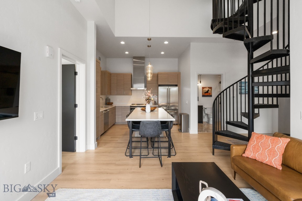 Step into elevated mountain living with Residence 3E, a stunning 3-bedroom, 3-bath penthouse in the brand-new Franklin Building. Perched in the vibrant heart of Big Sky’s Town Center, this residence blends high-end design with unbeatable access to everything Montana has to offer. Inside, enjoy an open, airy floor plan with premium finishes and 11-foot ceilings that create a sense of space and serenity. Step outside your doors to a private rooftop retreat—complete with a hot tub—where you can soak in panoramic views of Yellow Mountain, the golf course, and Lone Peak. The Franklin isn’t just a residence—it’s a lifestyle. Whether it’s morning coffee with mountain views or evening strolls to shops, restaurants, live music, or the farmers market, everything you love about Big Sky is just steps from your door. Outdoor adventure is equally close: trails for hiking, biking, and skiing are right around the corner, with Big Sky Resort only 10 minutes away and the Gallatin River just five. Crafted by the award-winning Bechtle Architects and built by Langlas Construction, this boutique building offers nine second-floor condos and nine third-floor penthouses, all designed with sound insulation, high-quality materials, and expansive windows to frame the views. Heated underground parking and private storage lockers make it easy to lock and leave, so your gear stays ready for your next adventure. Recently completed and move-in ready, The Franklin brings a new standard of mountain luxury to Big Sky—modern, convenient, and perfectly placed for year-round enjoyment.